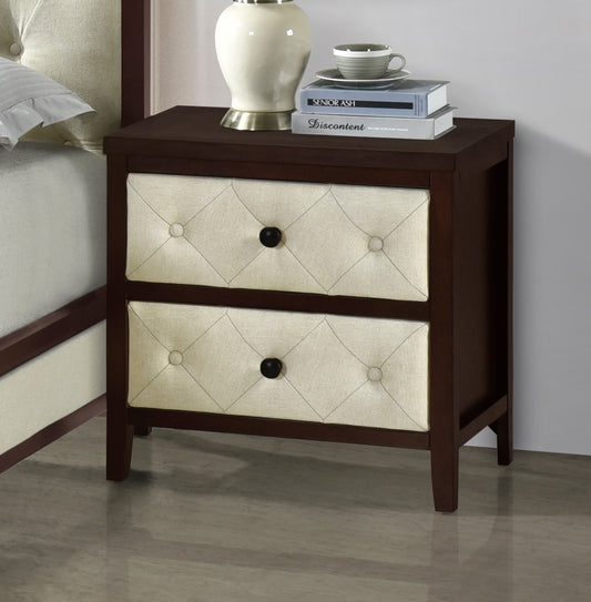 Dark wood bedside table with two tufted beige fabric drawers and black knobs