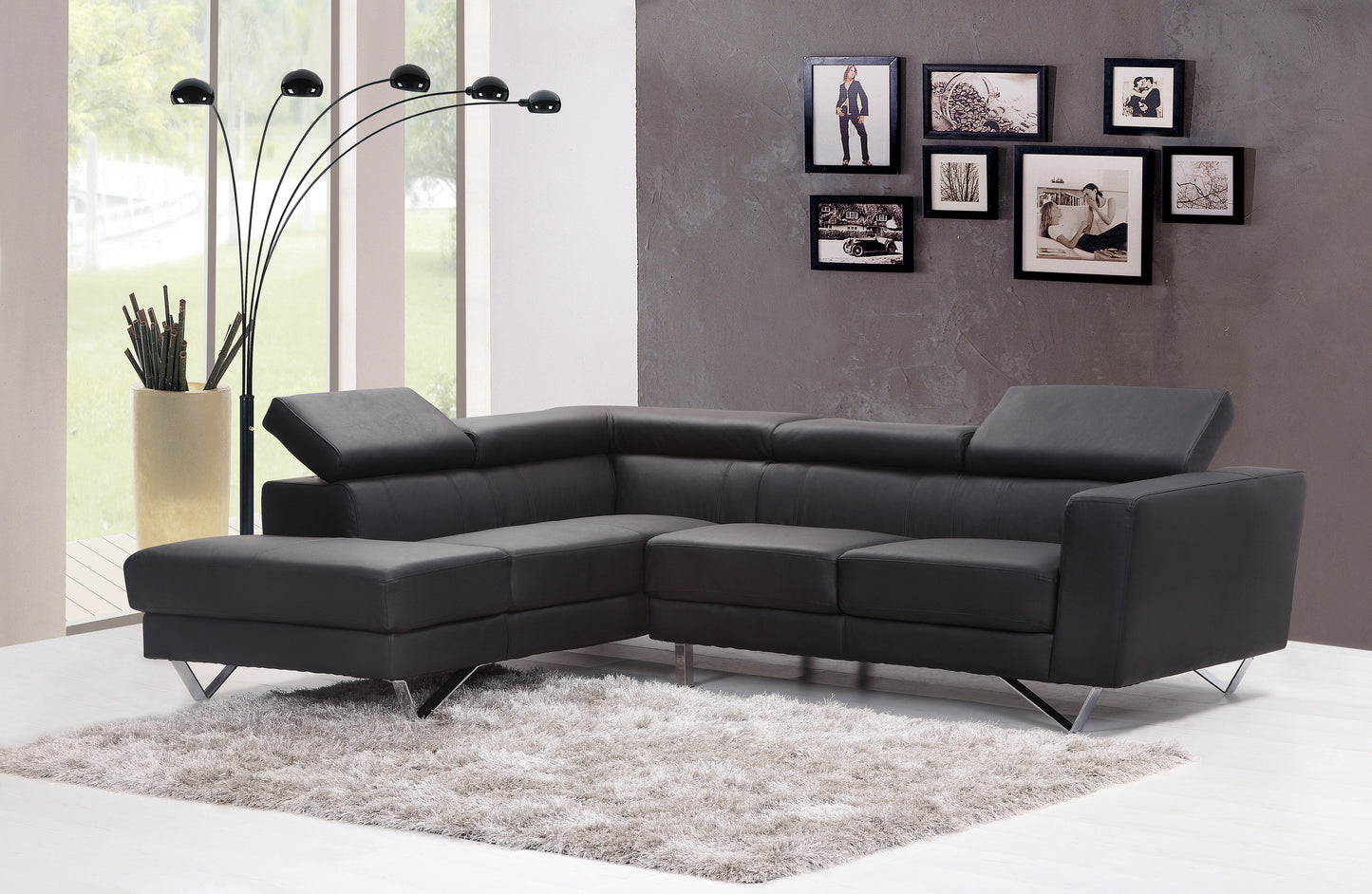 Dark grey leather sectional sofa with modern chrome legs perfect for living rooms