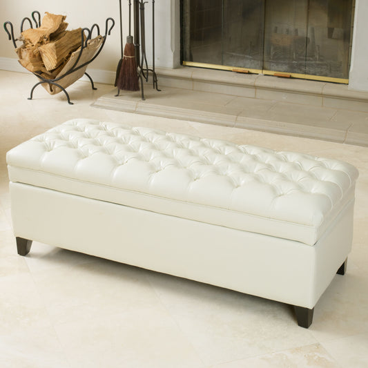 White tufted faux leather storage ottoman with dark wood legs