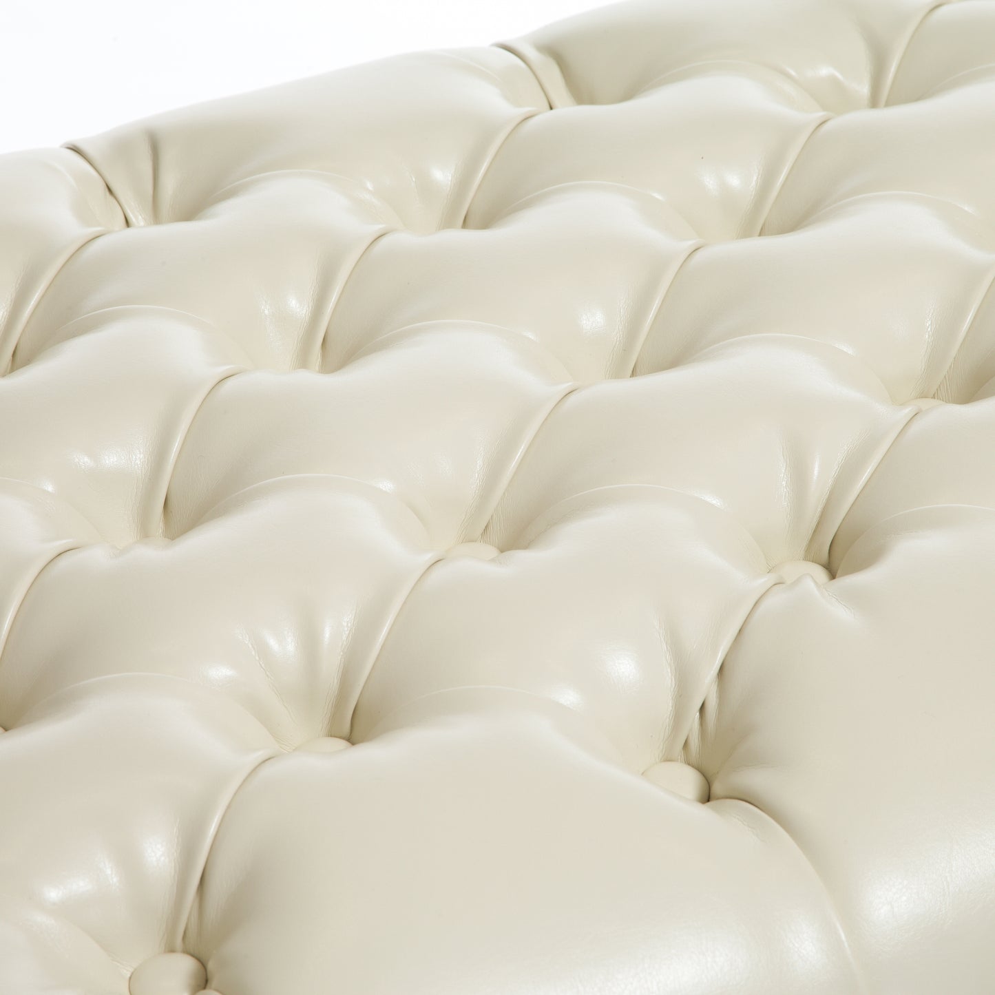 Cream faux leather tufted ottoman