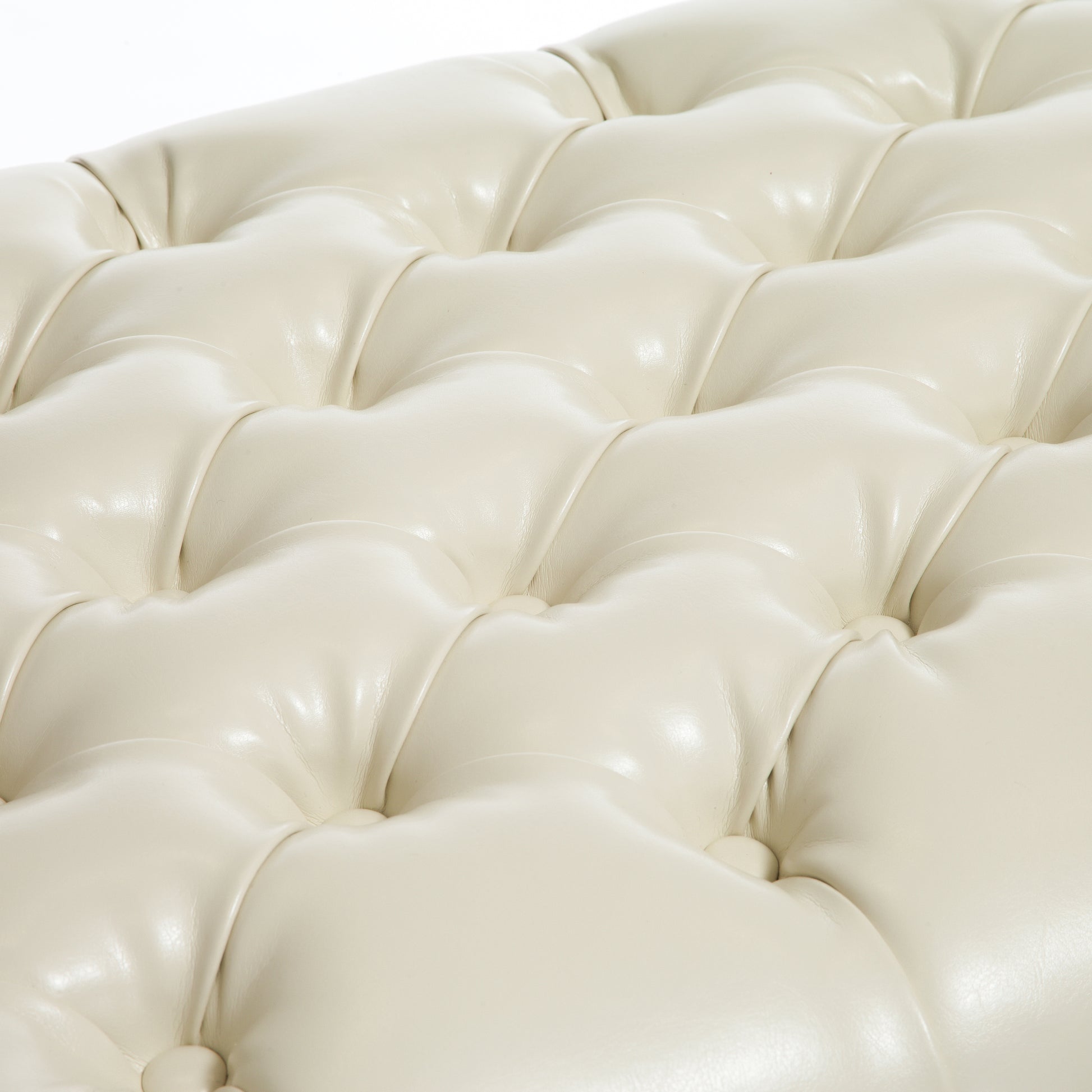 Cream faux leather tufted ottoman