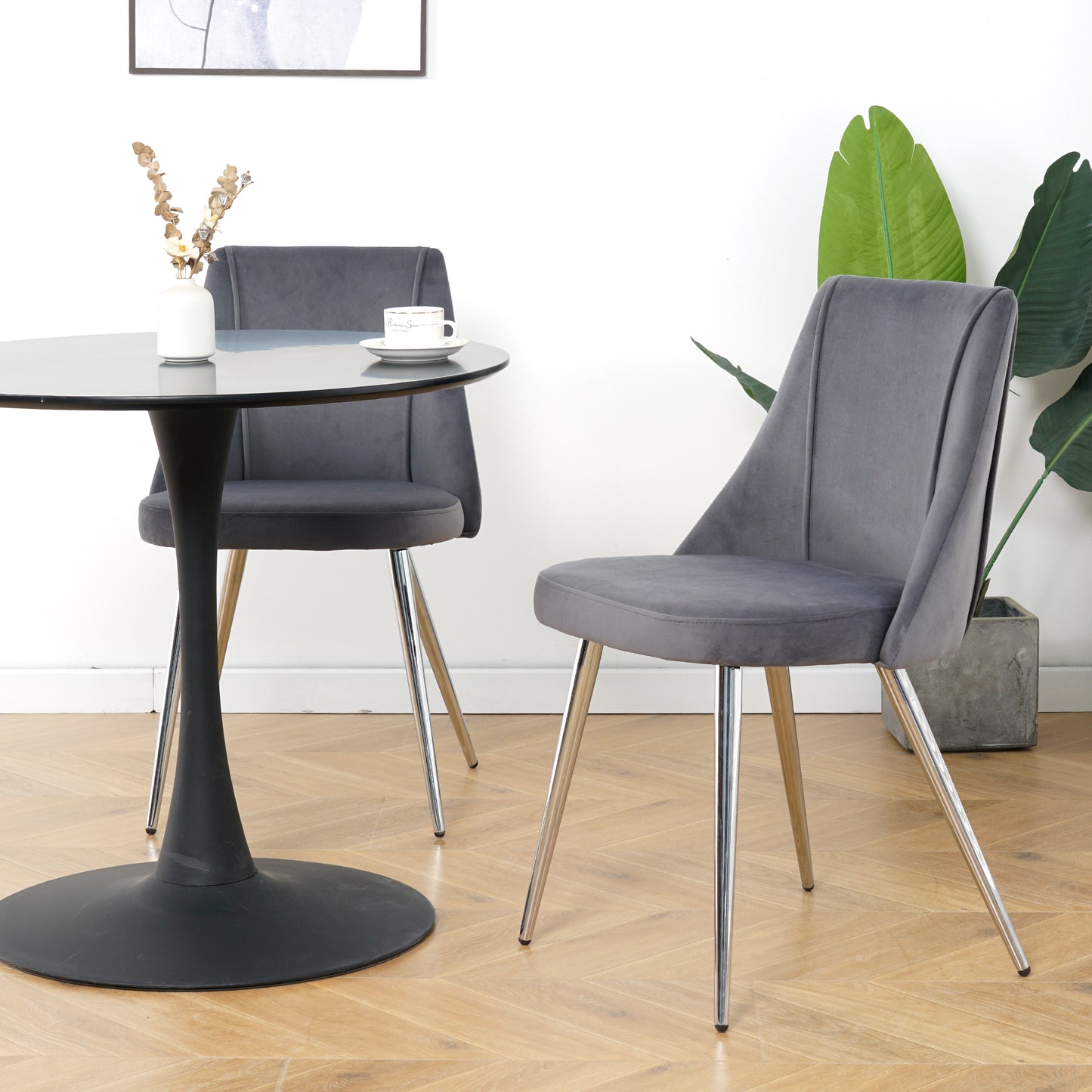 Grey velvet dining chair with plush upholstery and sleek chrome legs perfect for modern kitchens