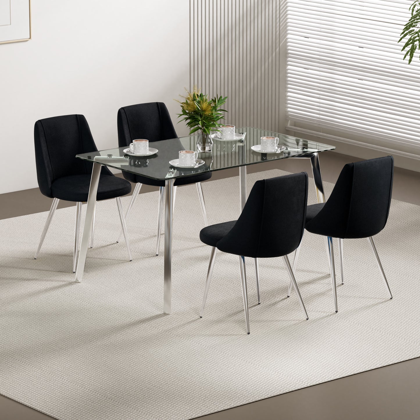 Modern black upholstered dining chairs with chrome legs surrounding a clear glass top dining table