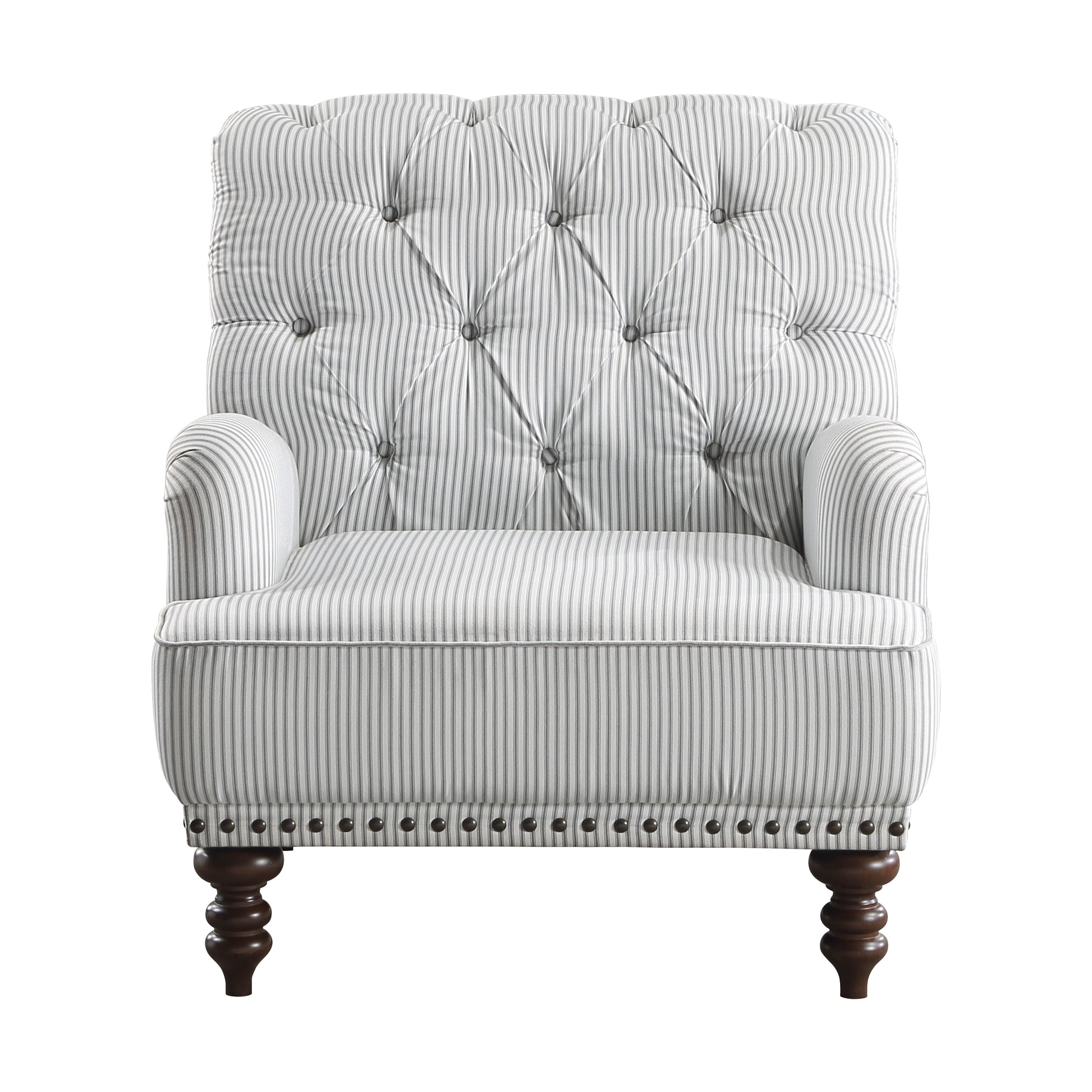 Tufted armchair in gray and white pinstripe fabric with dark wood legs and nailhead trim accent