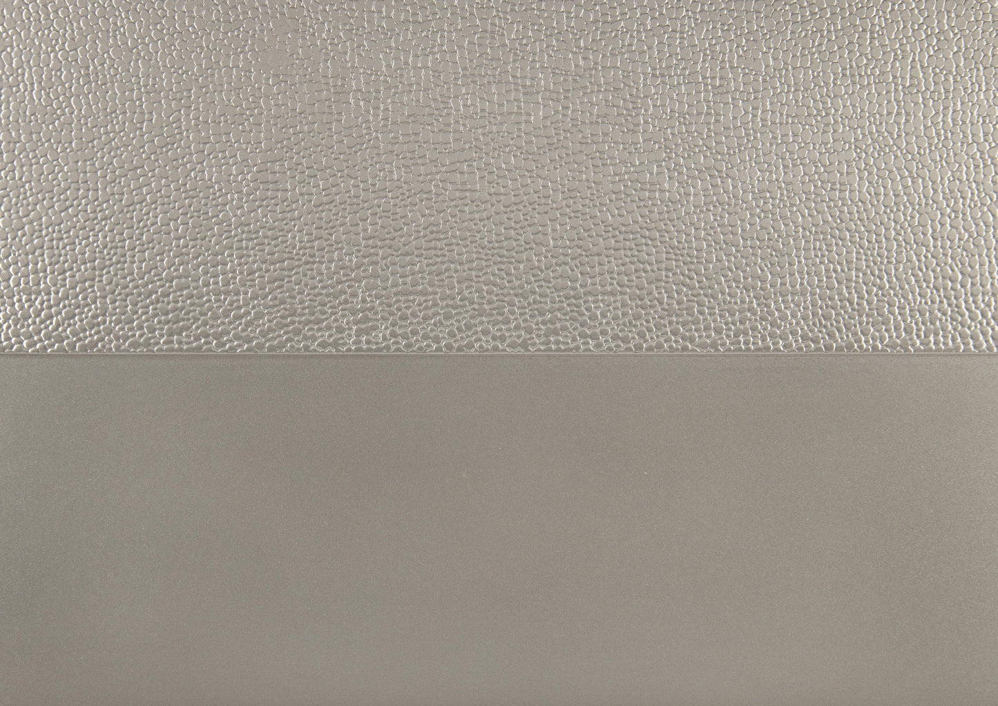 Textured silver embossed wallpaper panel with a matte lower section