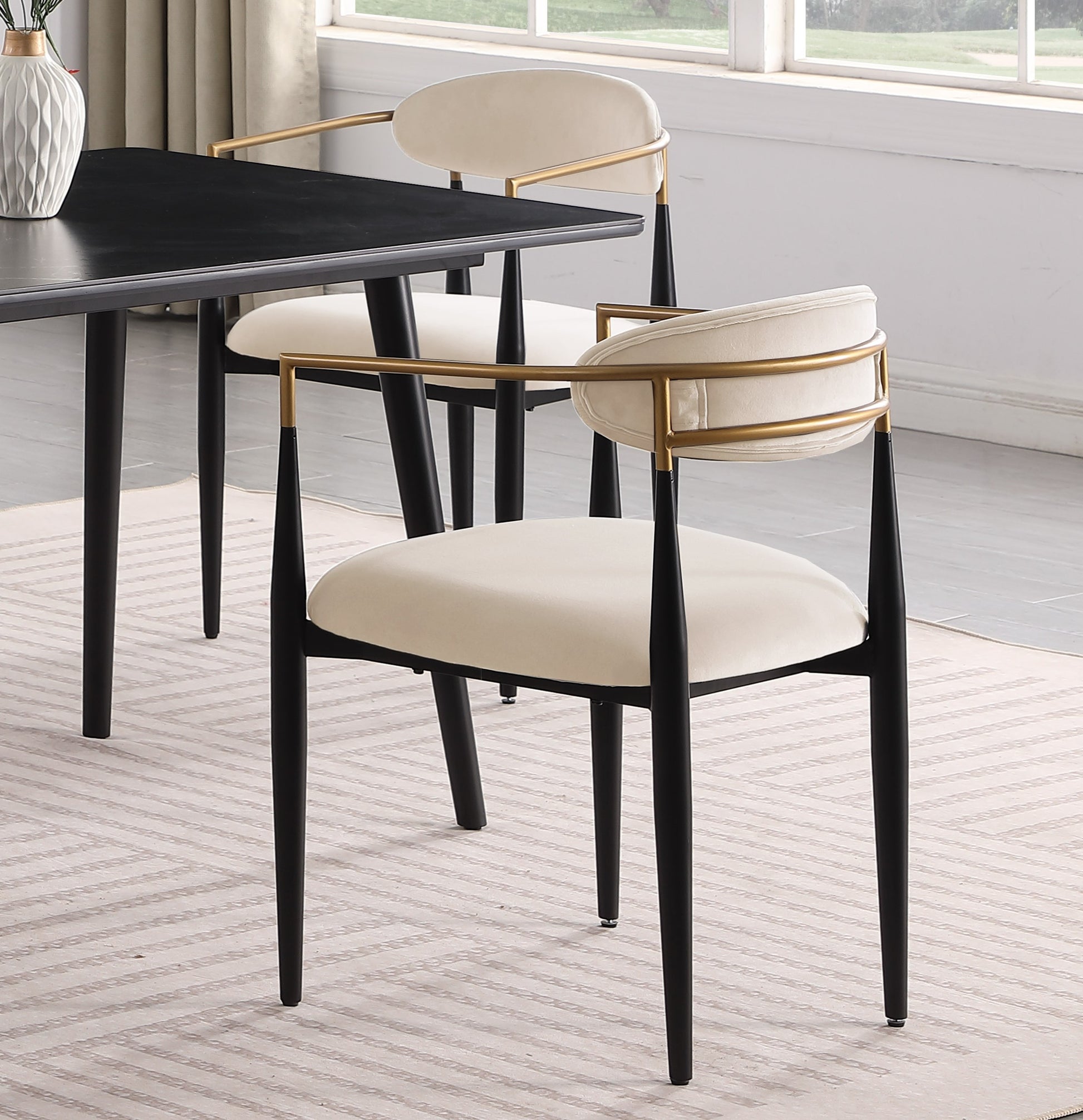 Modern cream velvet dining chair with gold metal frame and black legs
