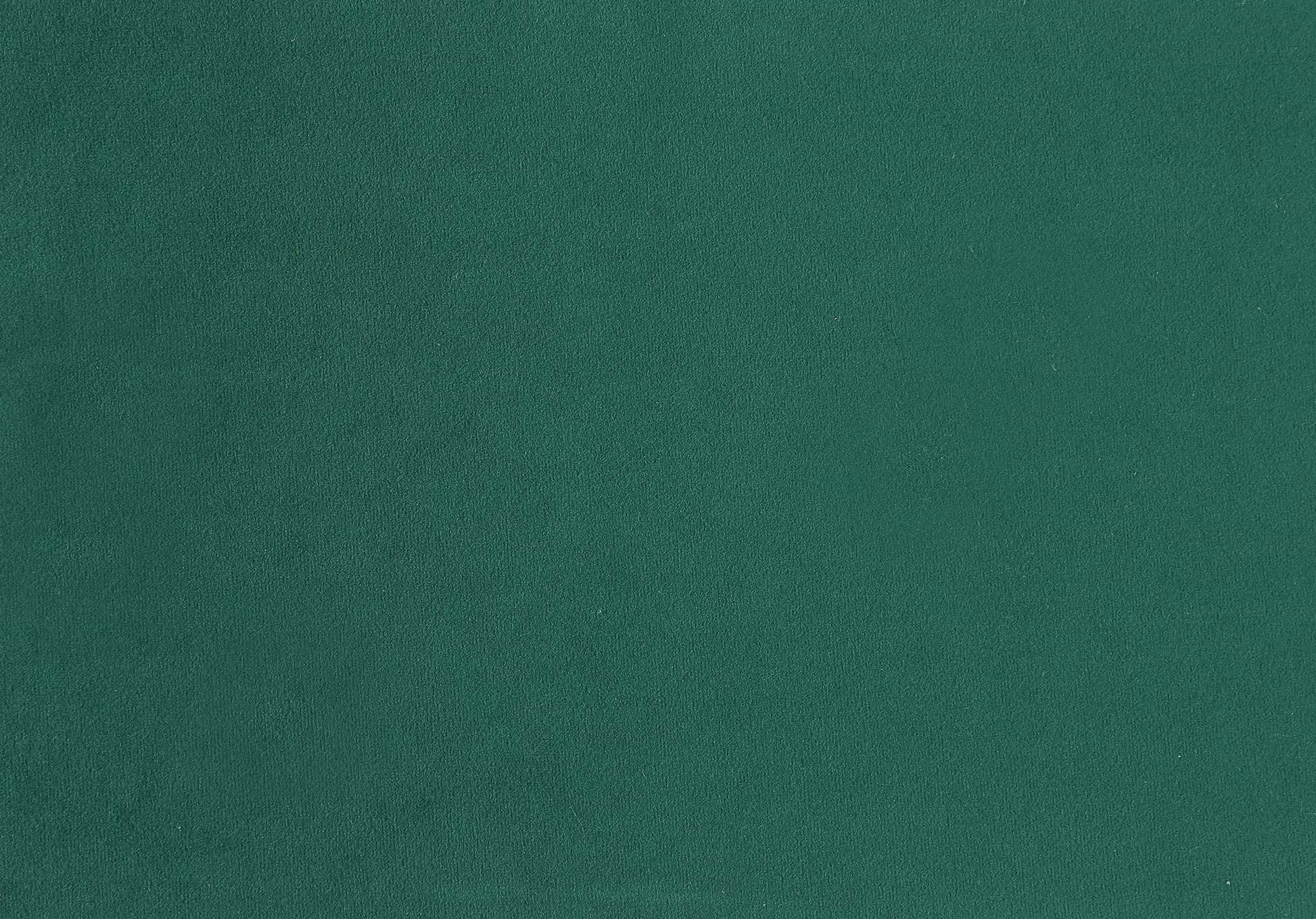 Deep emerald green velvet upholstery fabric with a plush textured surface
