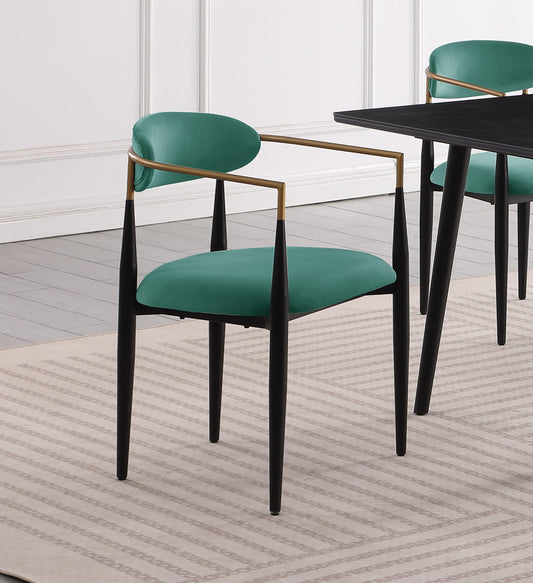 Emerald green velvet dining chair with gold arms and black legs