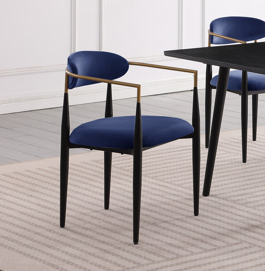 Dark blue velvet dining chair with black legs and gold accents