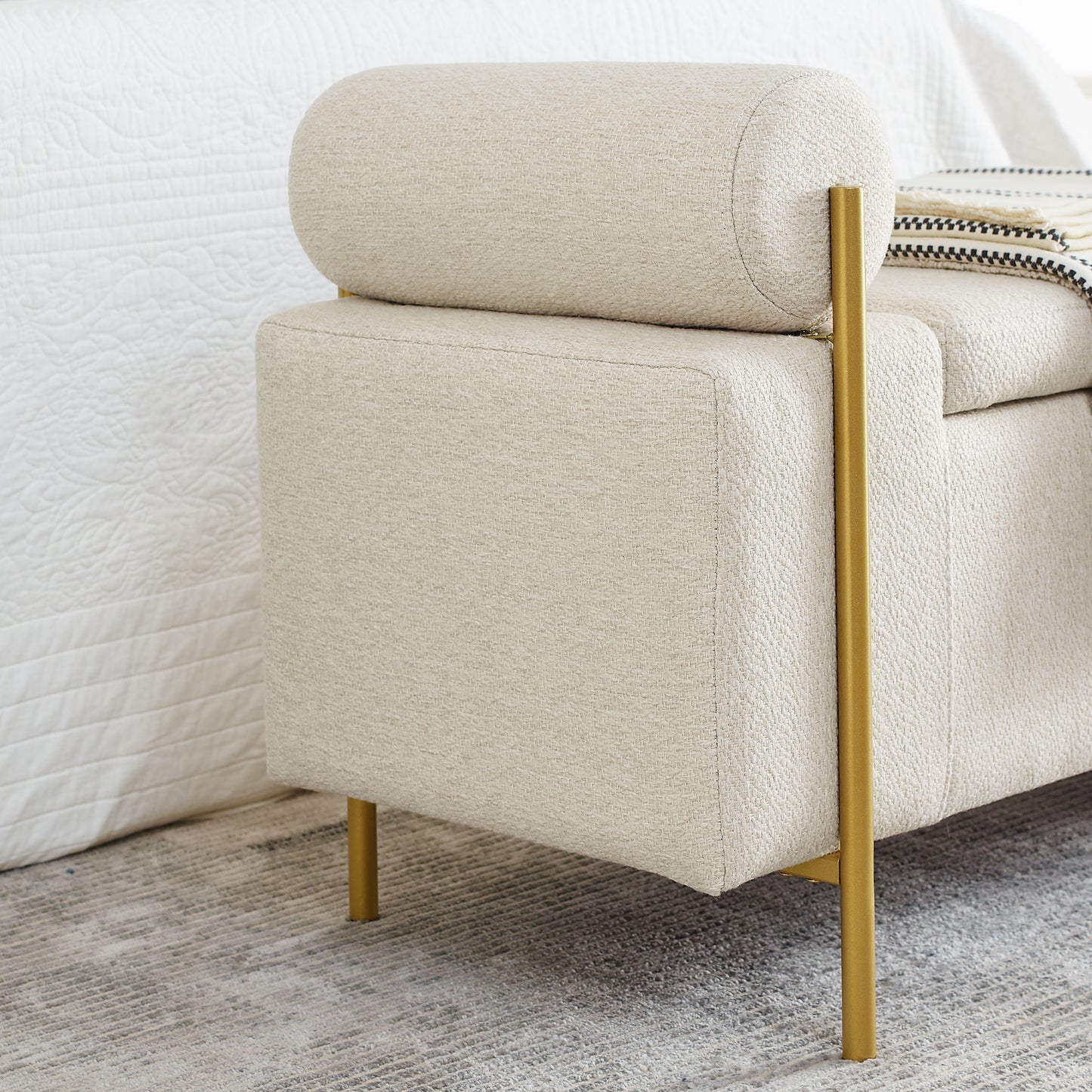 Cream upholstered accent bench with gold legs