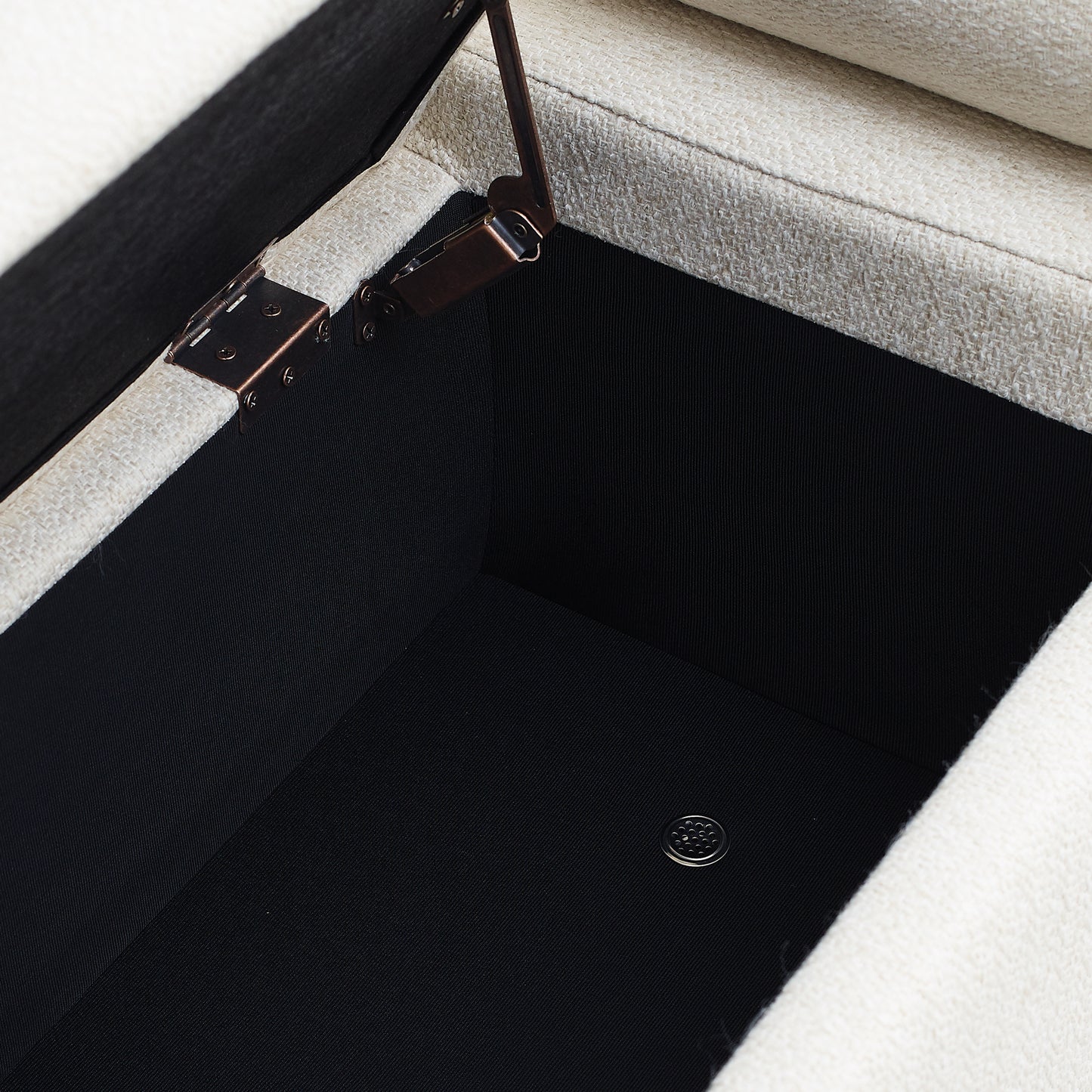 Open ottoman storage with beige textured fabric exterior and black interior lining