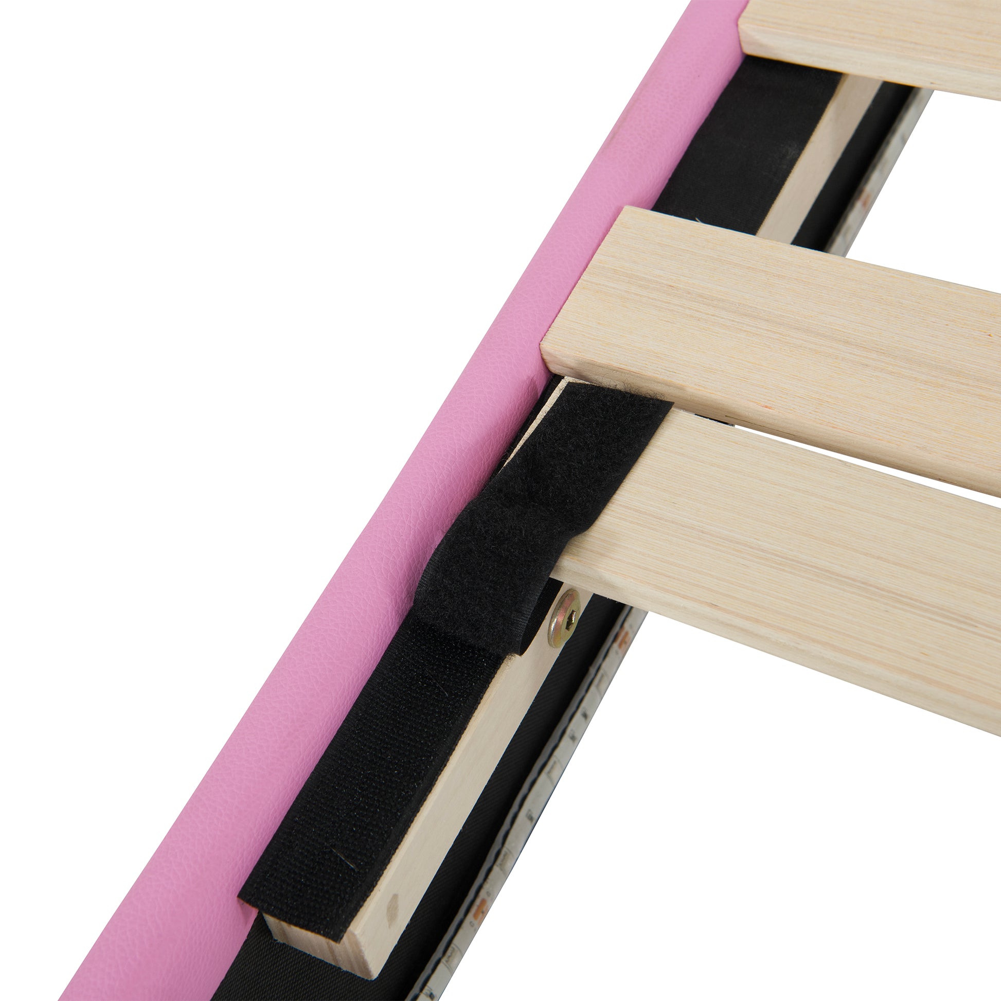 Pink faux leather bed frame detail with wooden slats and black velcro strap for assembly