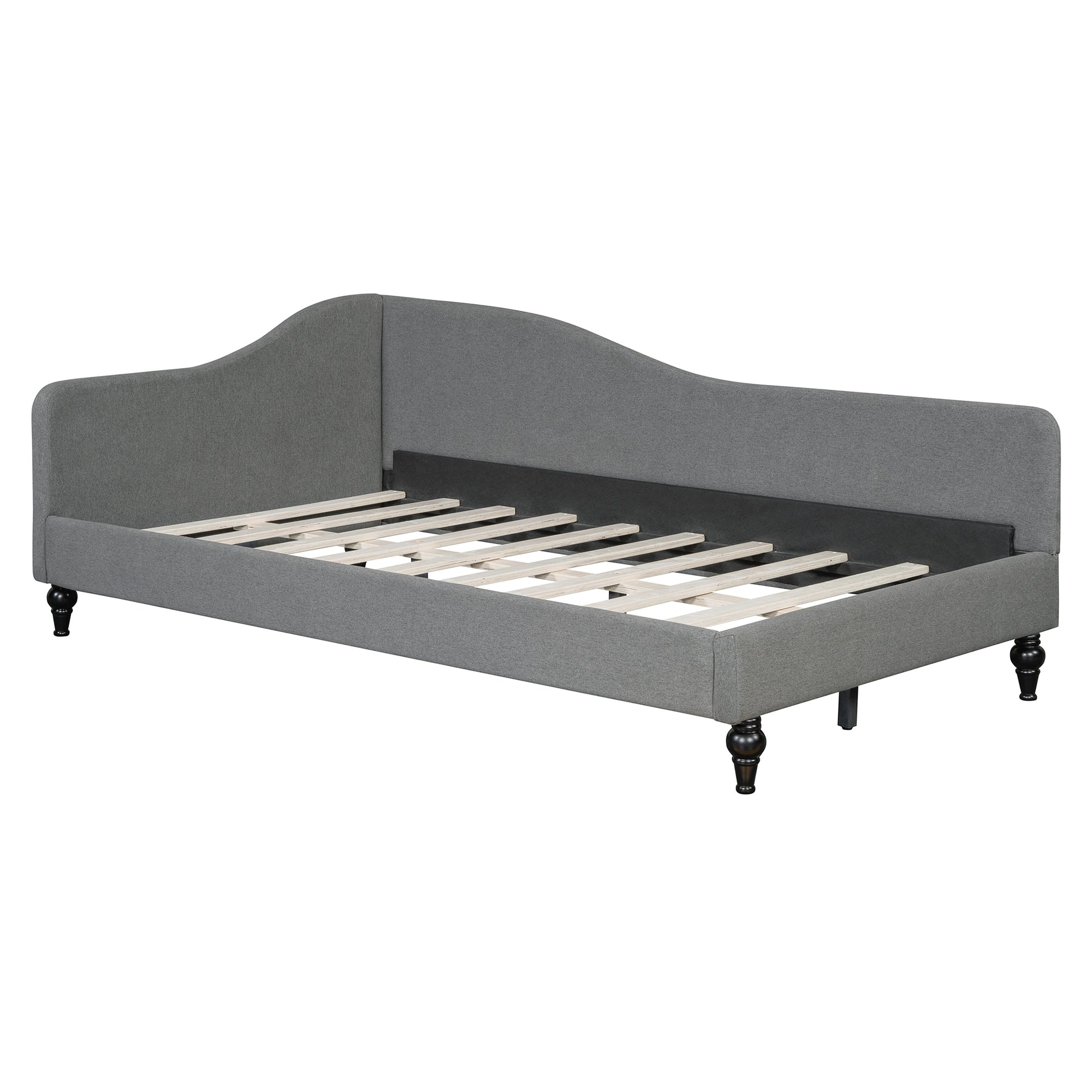 Gray upholstered daybed with wooden slats and turned legs