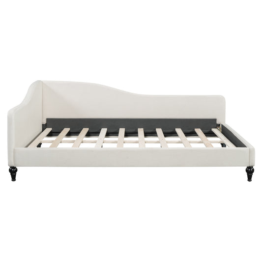 Cream upholstered daybed with curved back and wooden slats