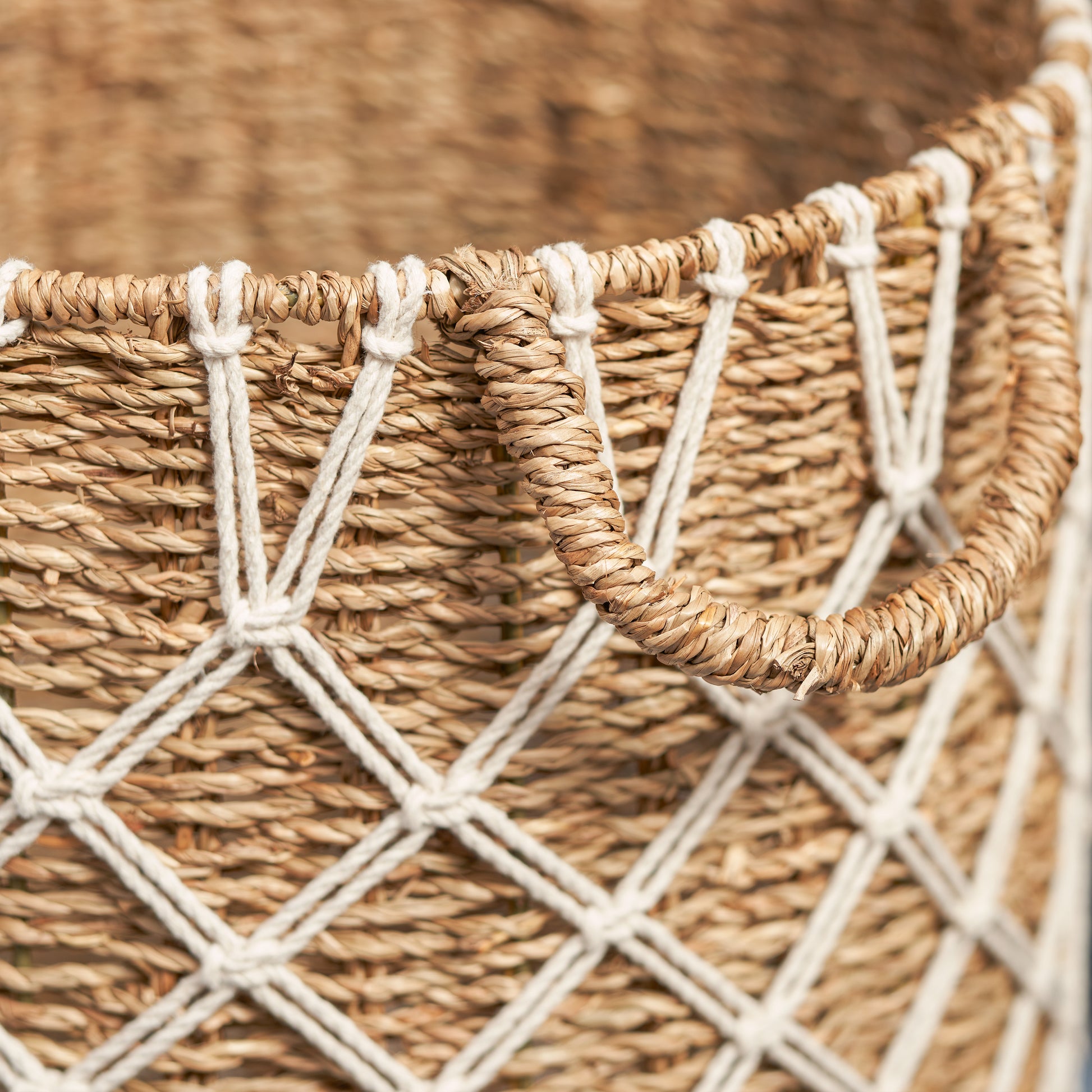 Woven seagrass basket with macrame detail and sturdy handles