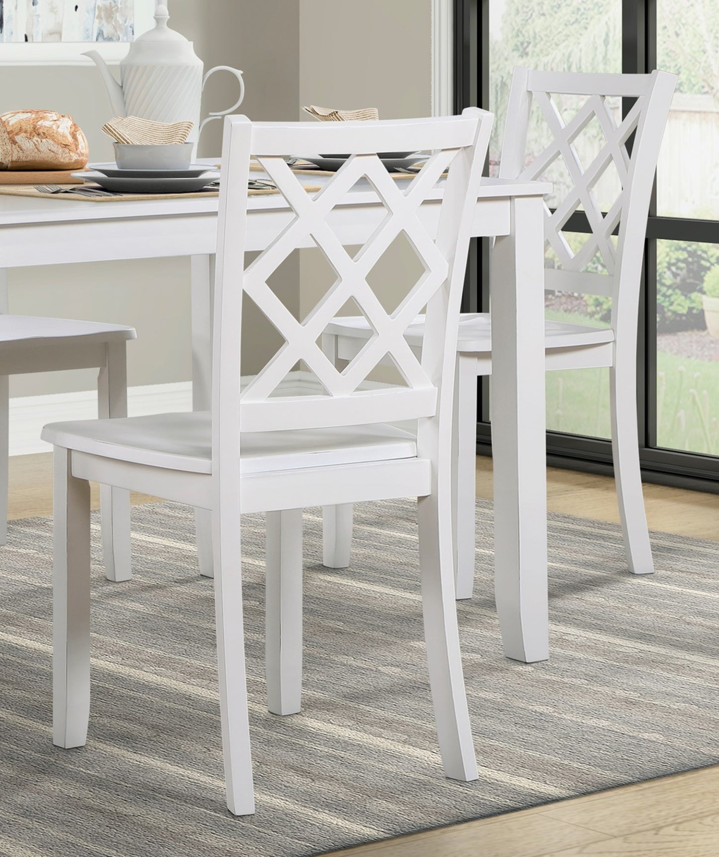 White wooden dining chair with decorative diamondpatterned backrest
