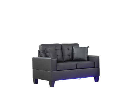 Black faux leather loveseat with tufted back and blue LED accent lighting