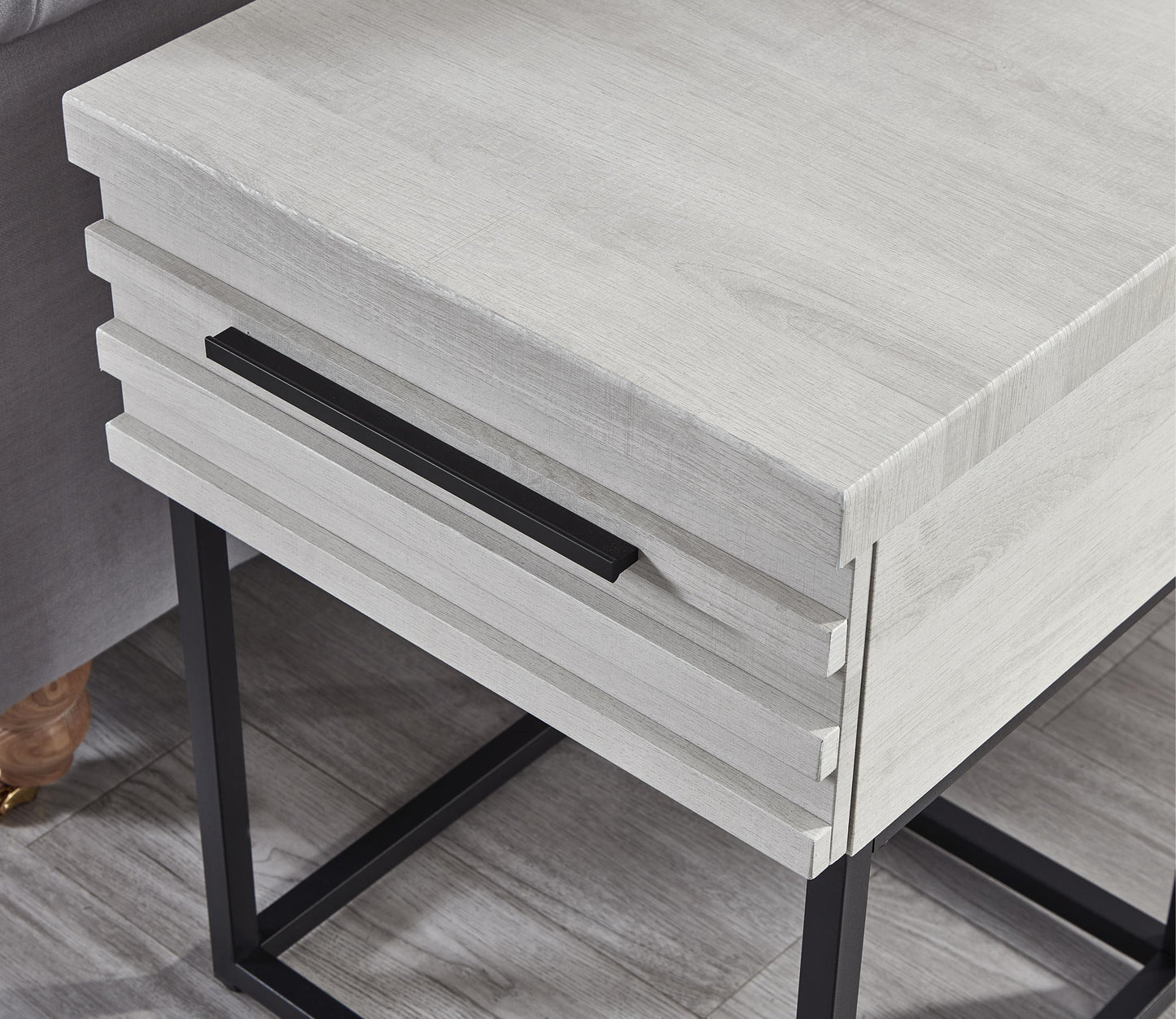 Modern white wood end table with black drawer pull and metal legs