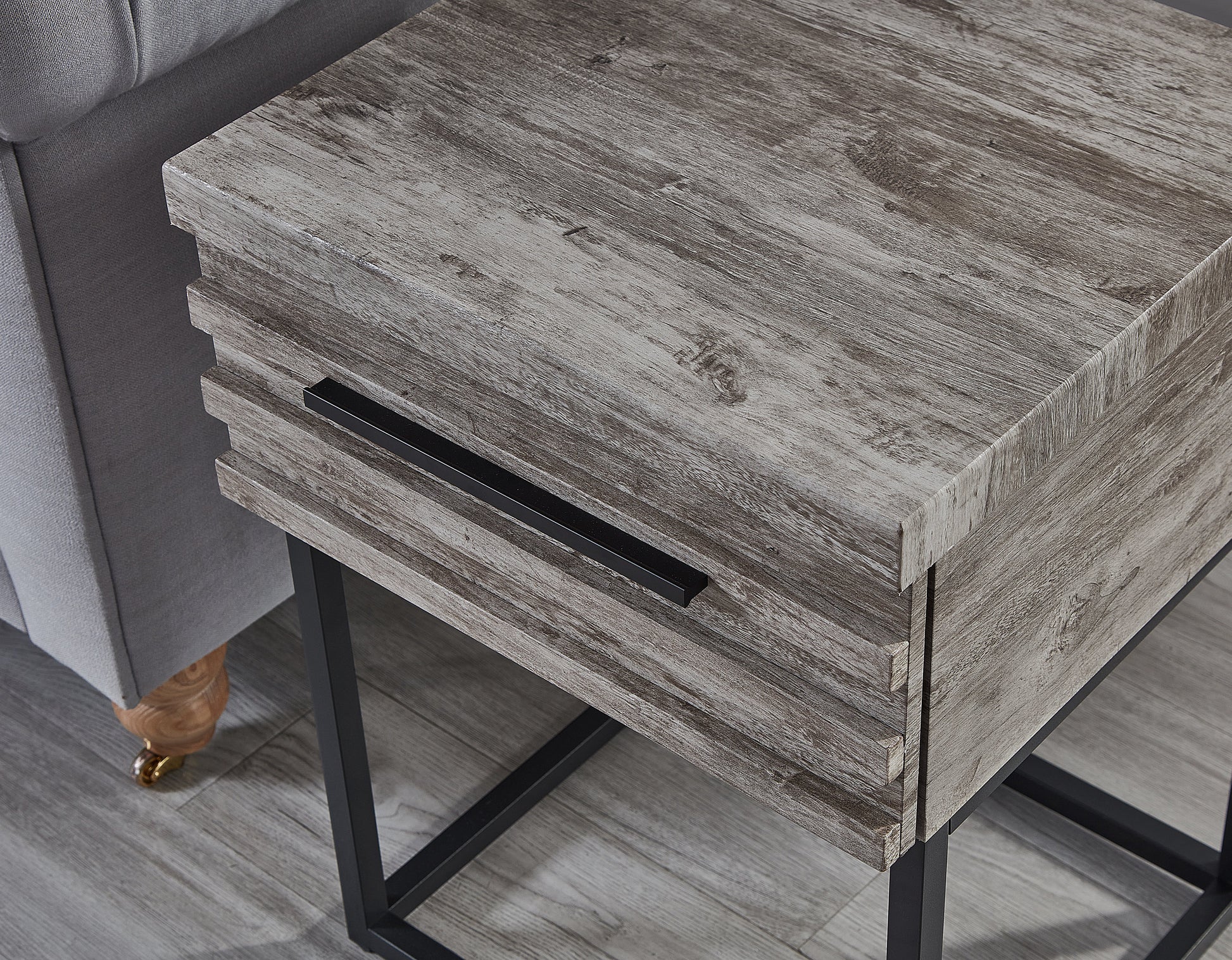 weathered wood side table with black metal legs and drawer