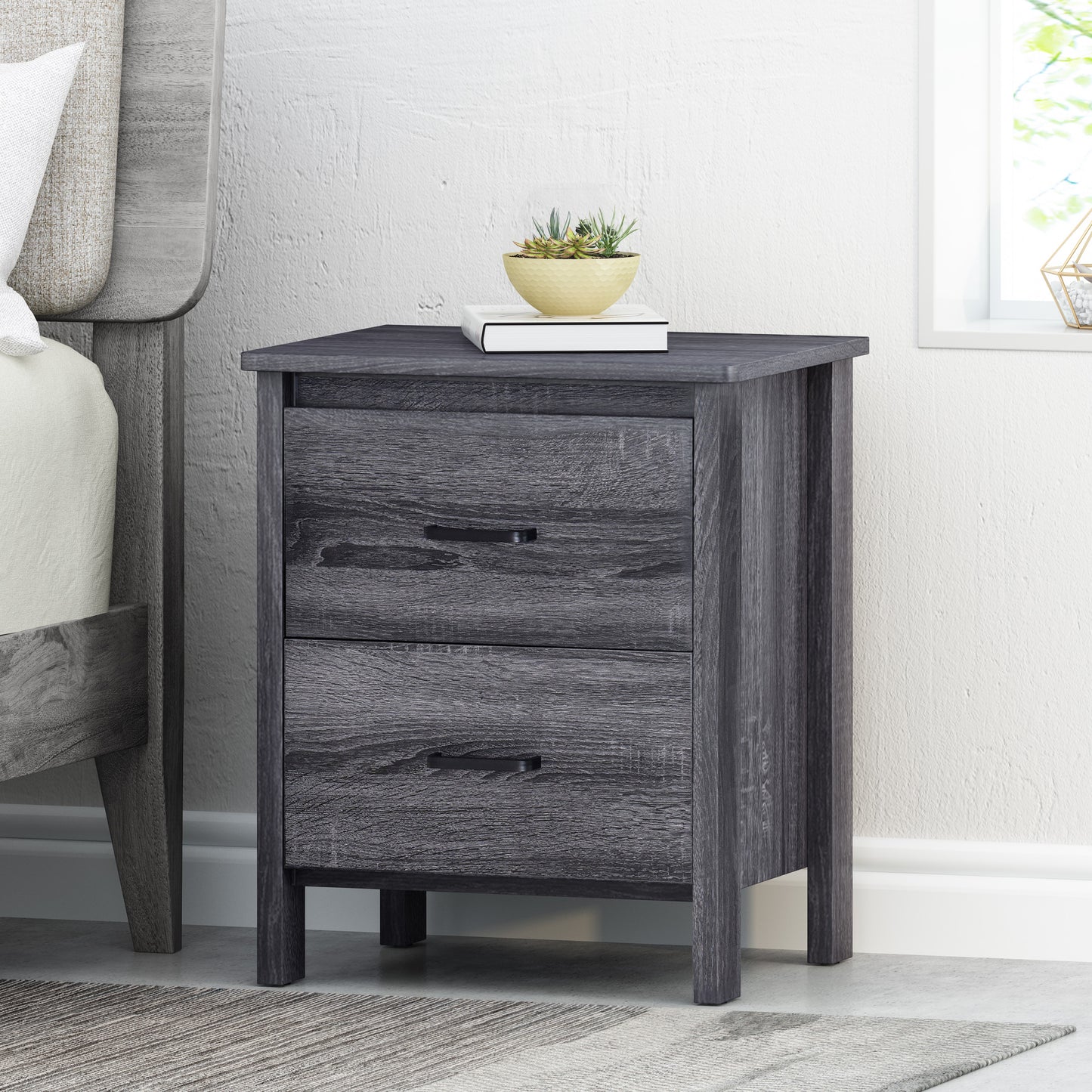 Gray wood grain nightstand with two drawers and black metal pulls