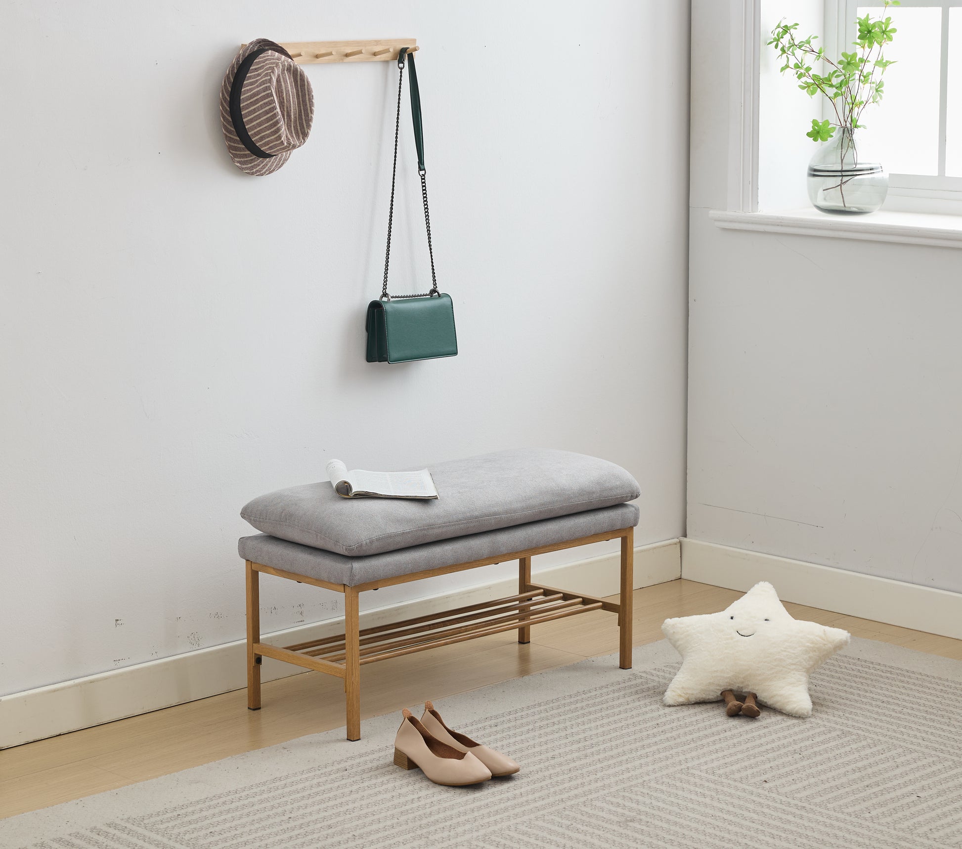Grey fabric entryway bench with wooden frame and shoe rack
