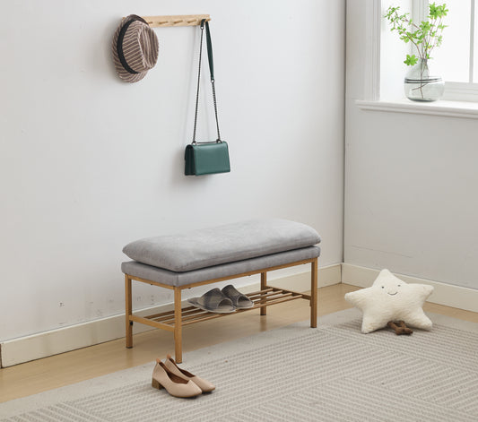 Grey fabric entryway bench with wooden frame and shoe rack
