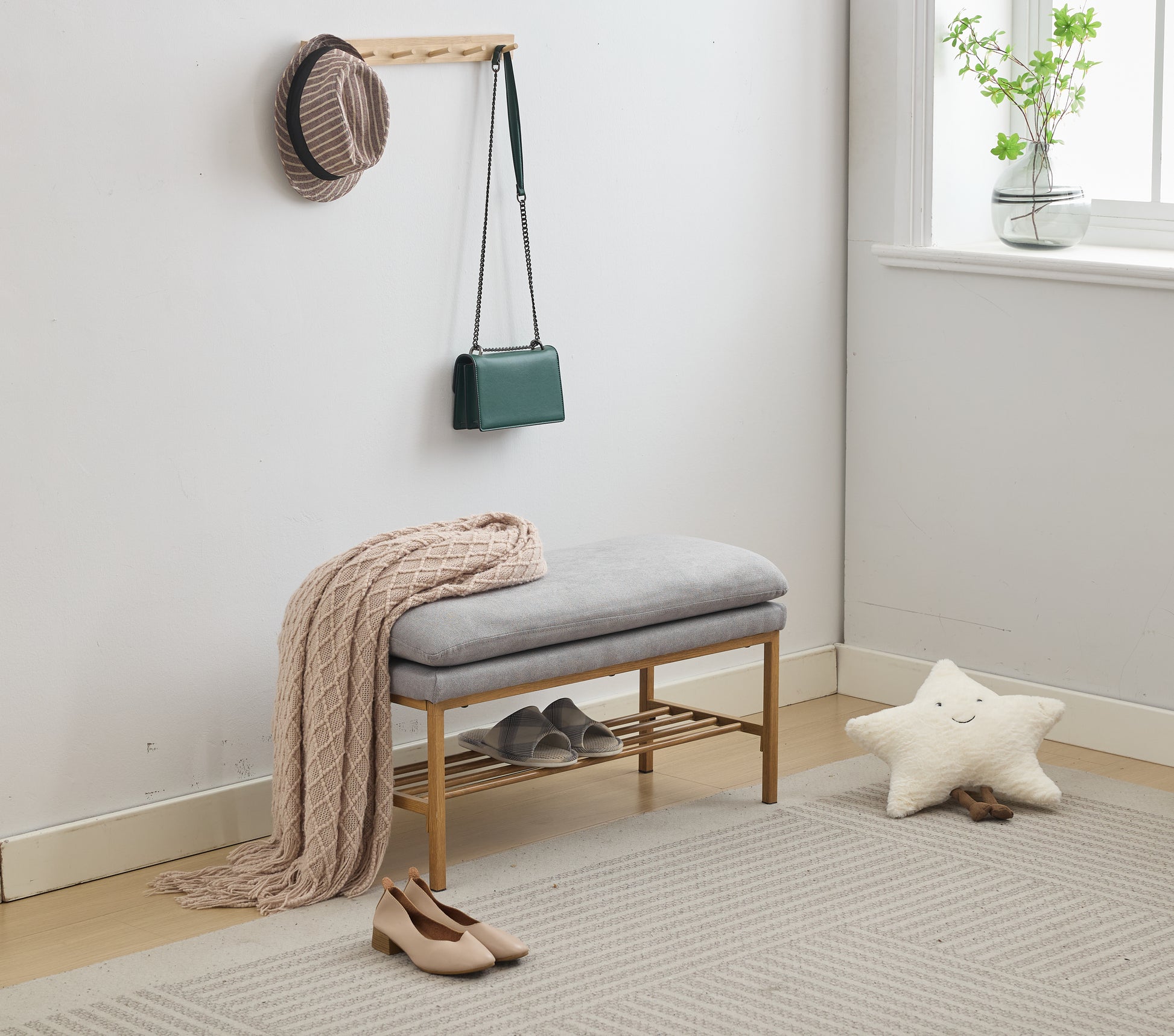 Grey upholstered bench with wooden shoe rack