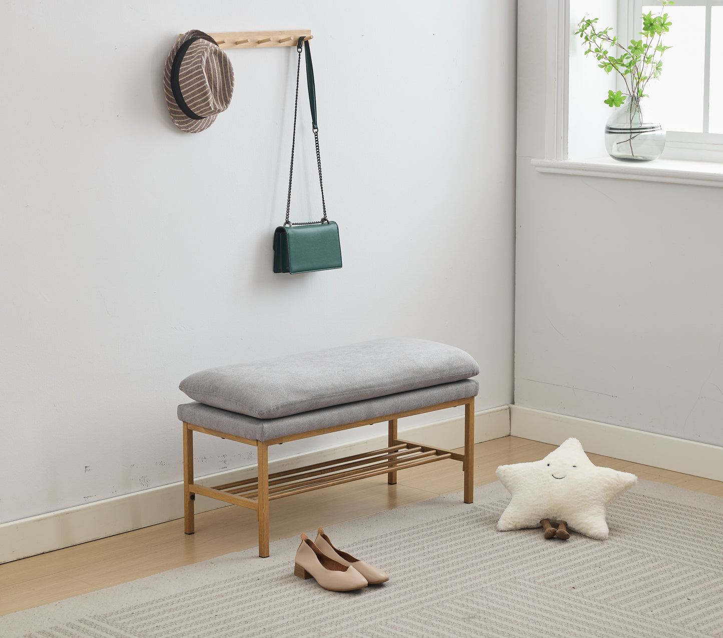Gray upholstered entryway bench with wooden frame and shoe rack