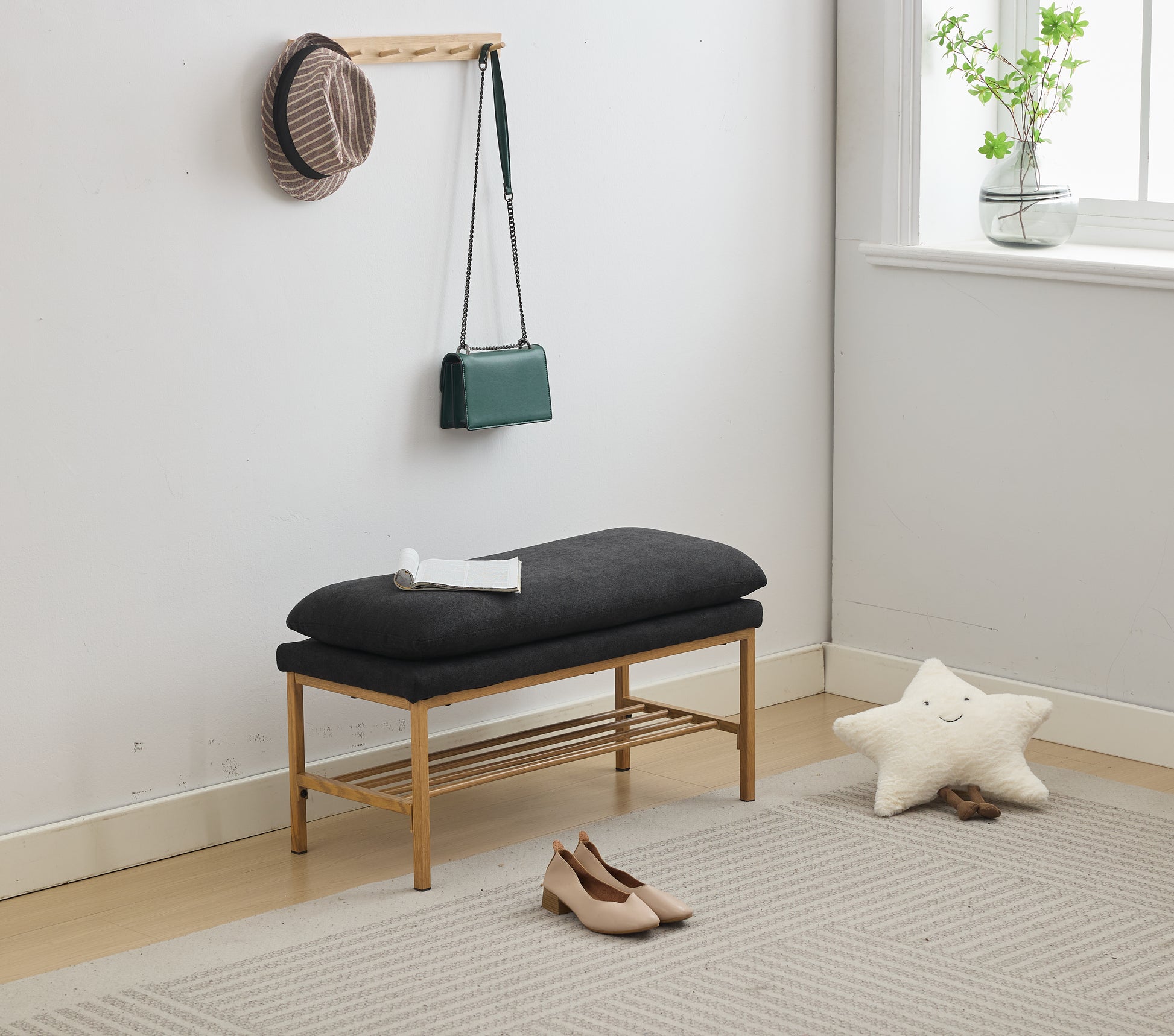 Dark gray upholstered entryway bench with wooden frame and shoe rack