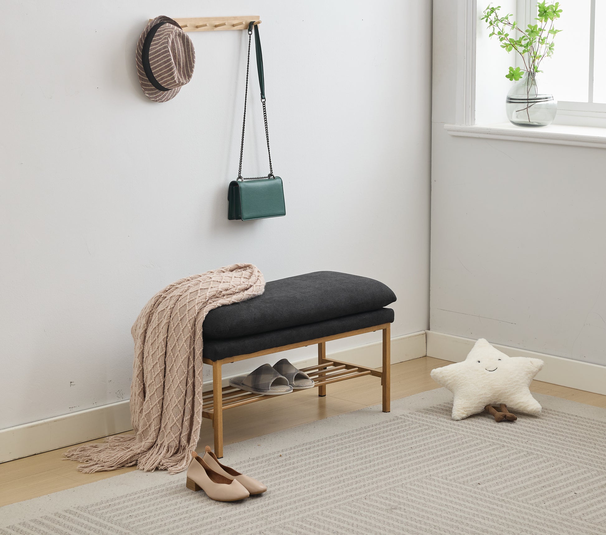 Dark grey upholstered entryway bench with a wooden shelf for shoe storage