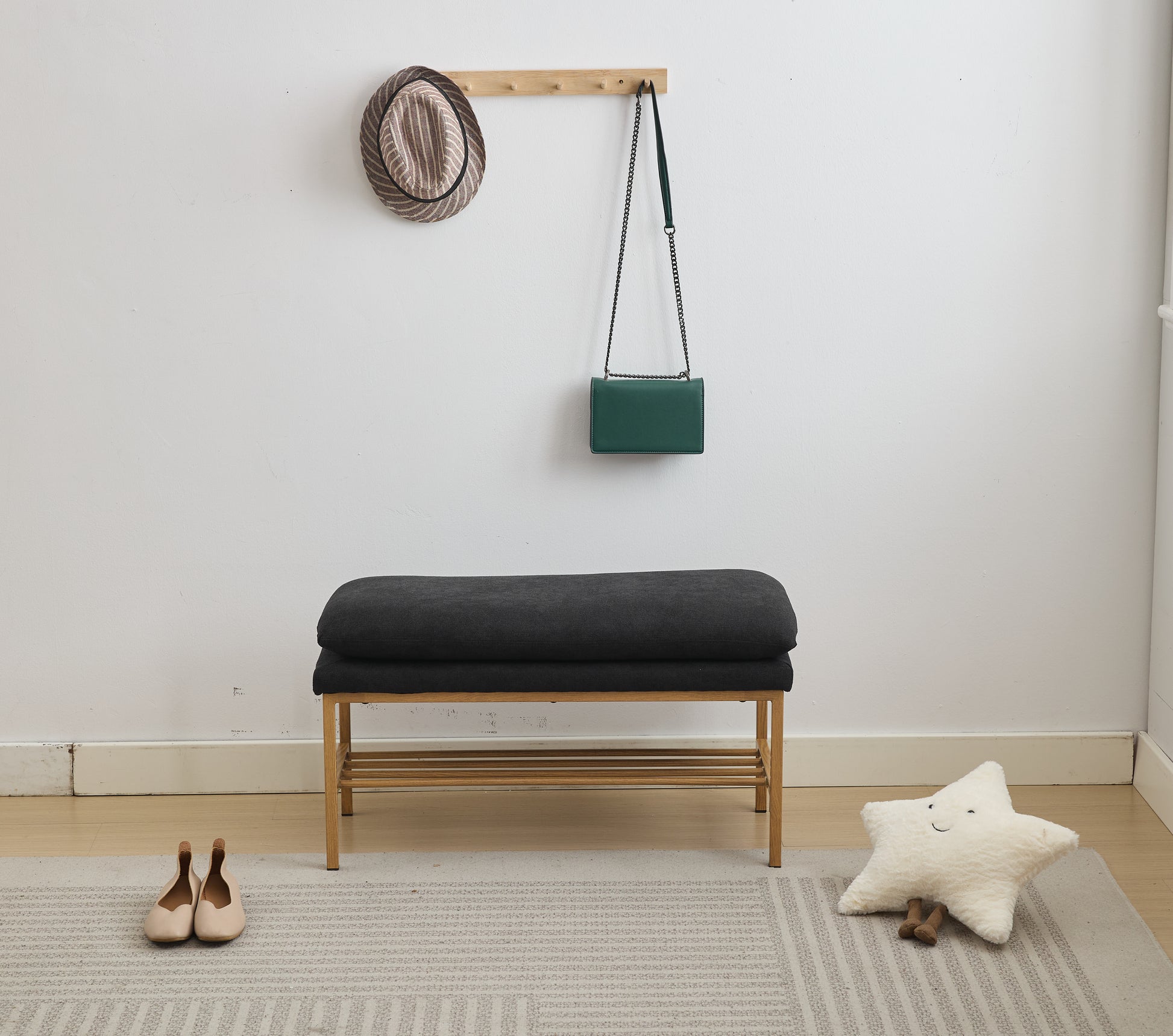 Dark gray fabric entryway bench with wooden slatted shoe shelf