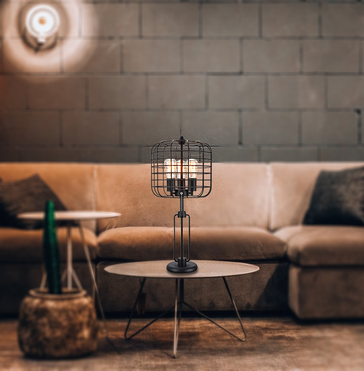 Industrial black metal cage desk lamp with two exposed Edison bulbs