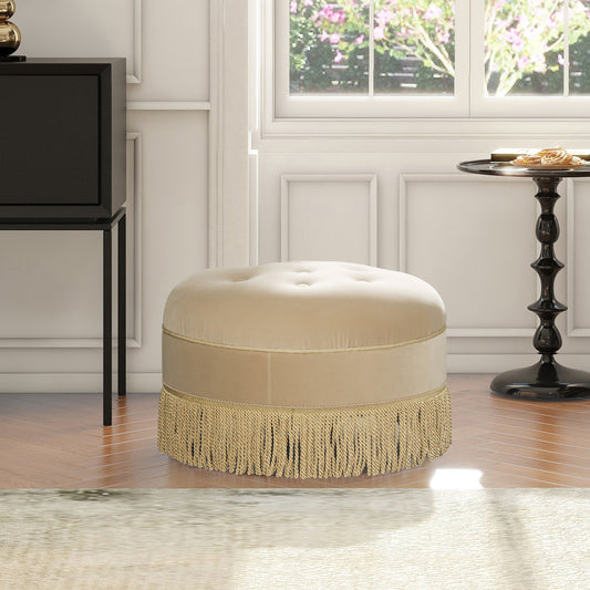 Tufted velvet ottoman in beige with gold fringe trim perfect accent for living room