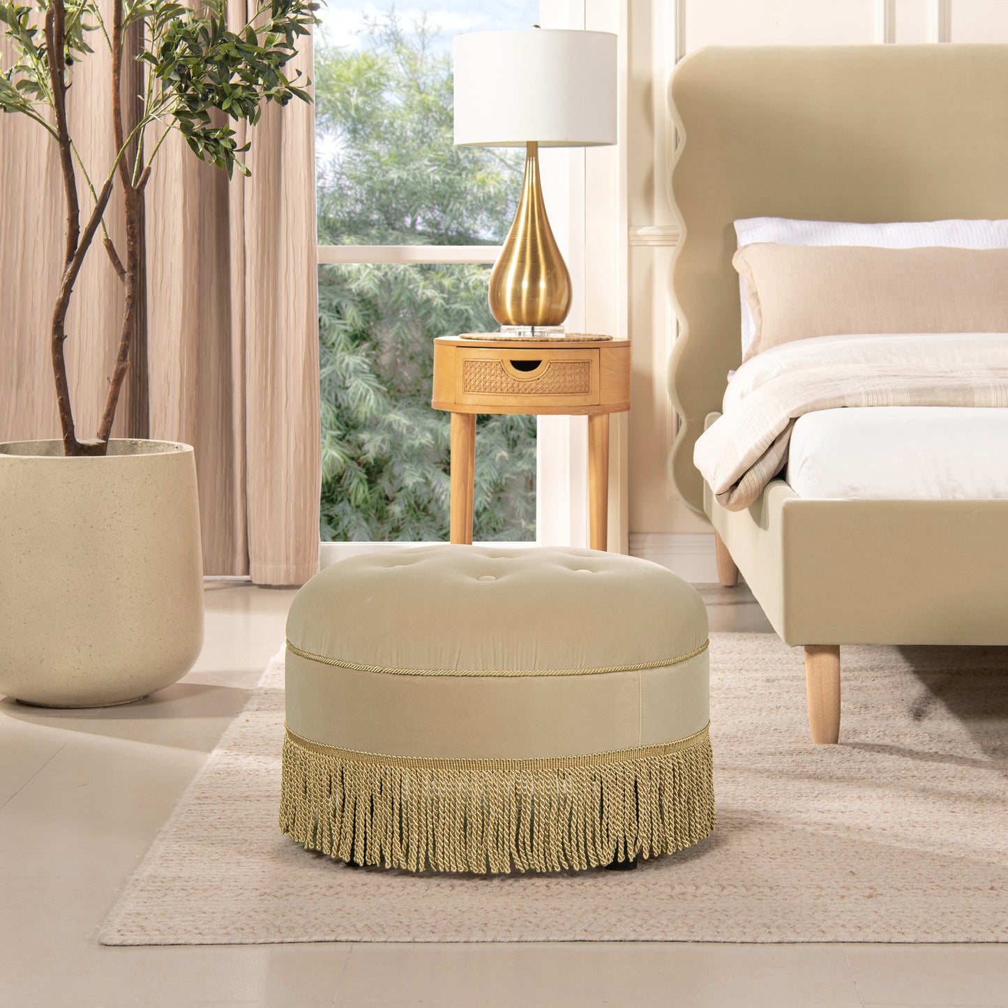 Tufted cream velvet ottoman with gold fringe detail perfect accent stool