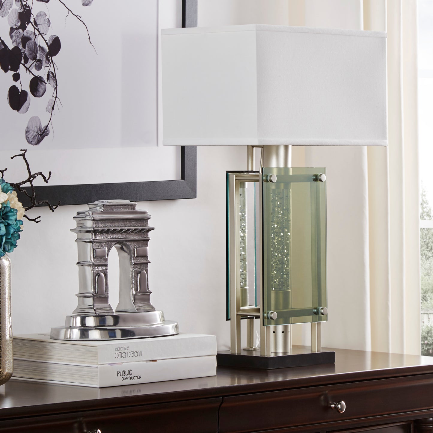 Modern table lamp with brushed nickel finish and crystalfilled glass accents