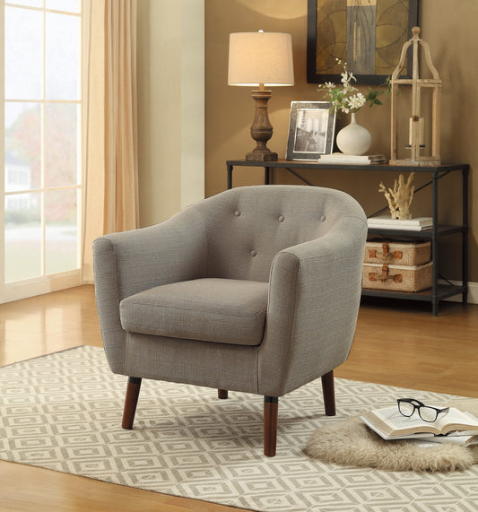 Gray upholstered armchair with tufted back and dark wood legs