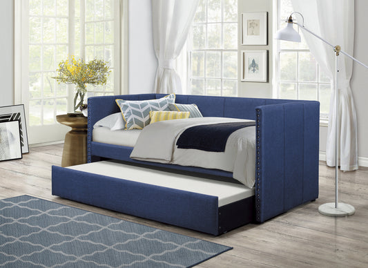 Navy upholstered daybed with pullout trundle perfect for guest rooms