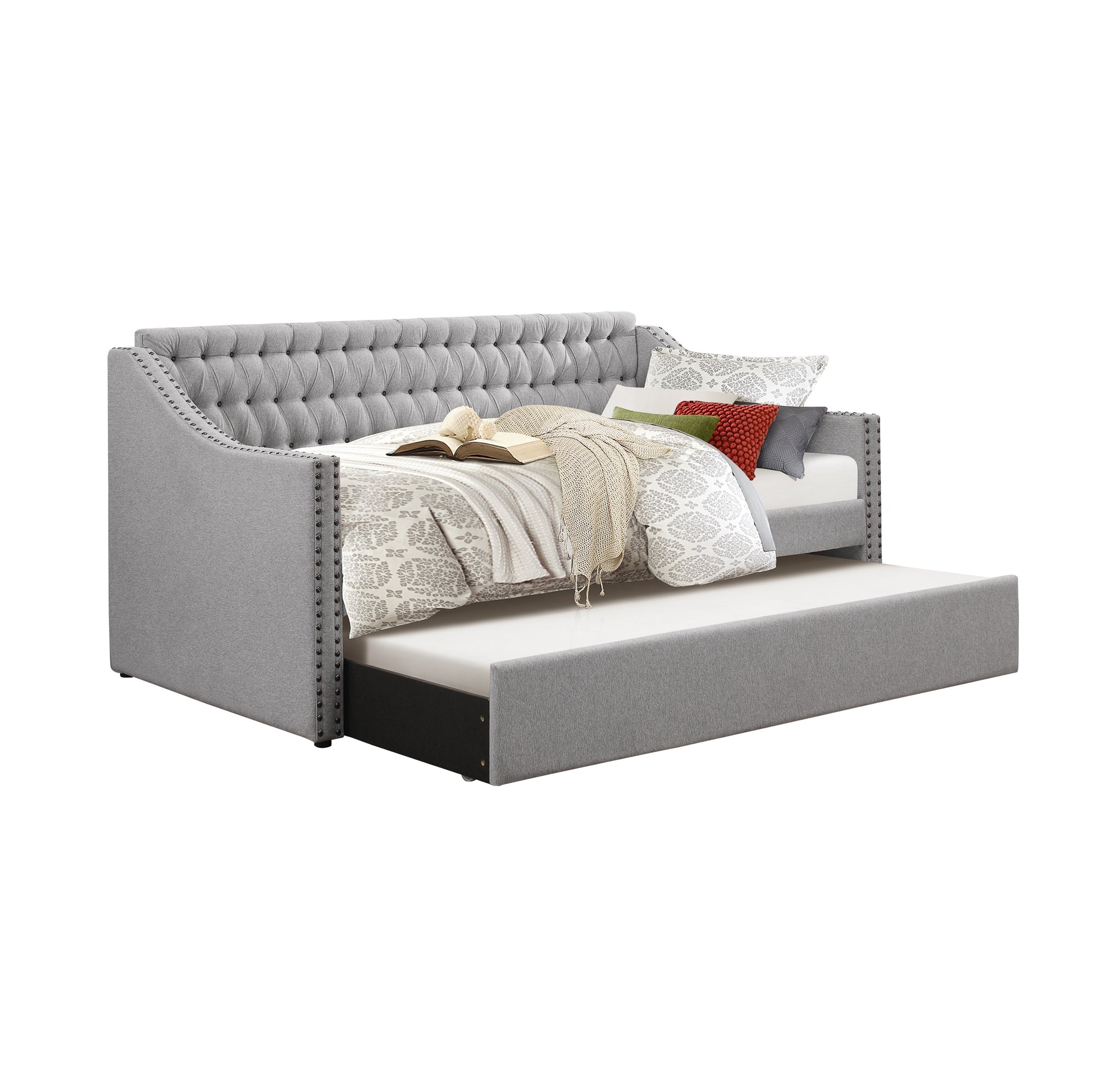 Grey upholstered daybed with tufted back and nailhead trim pullout trundle bed