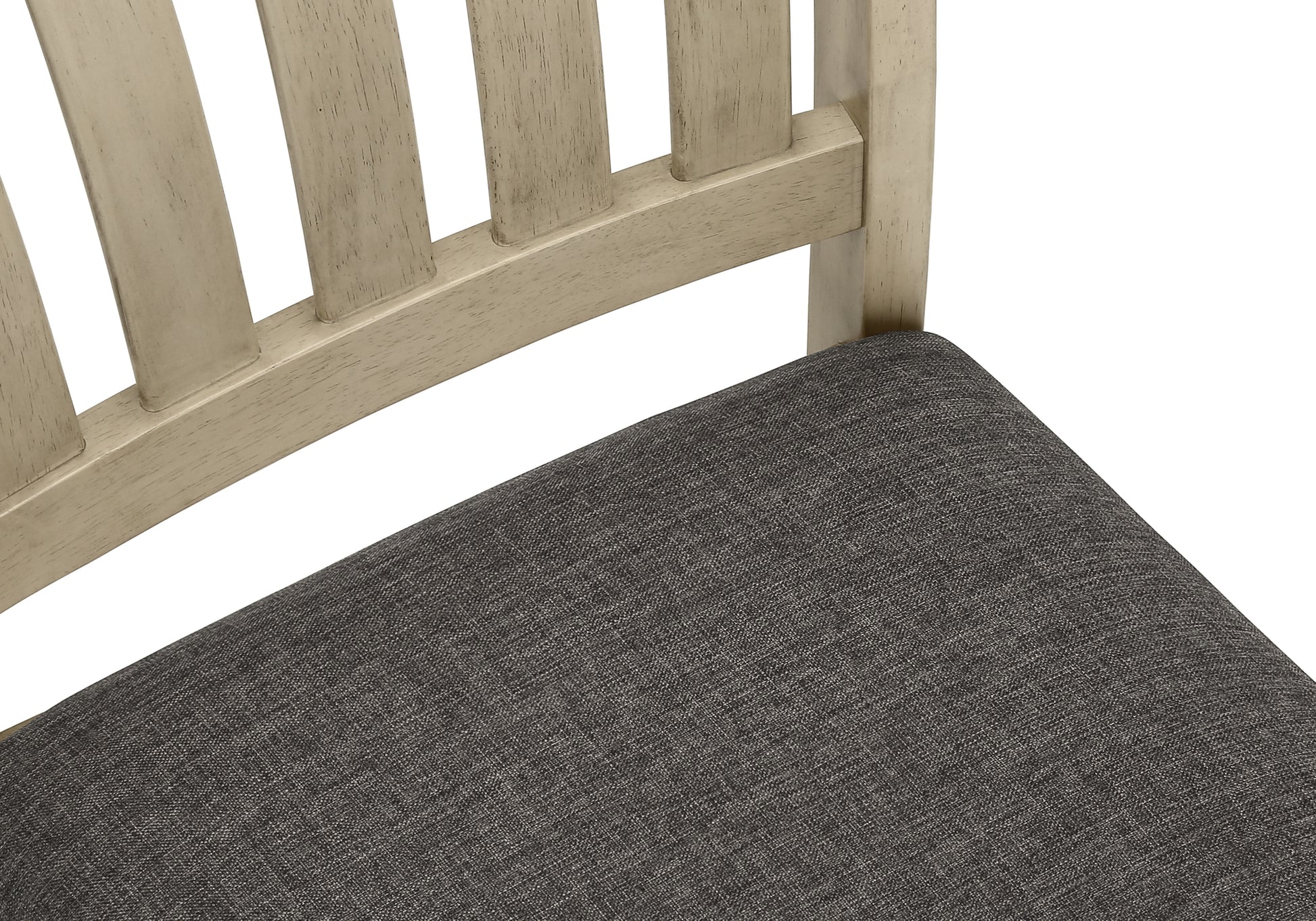 Closeup of light wood dining chair with grey textured seat cushion