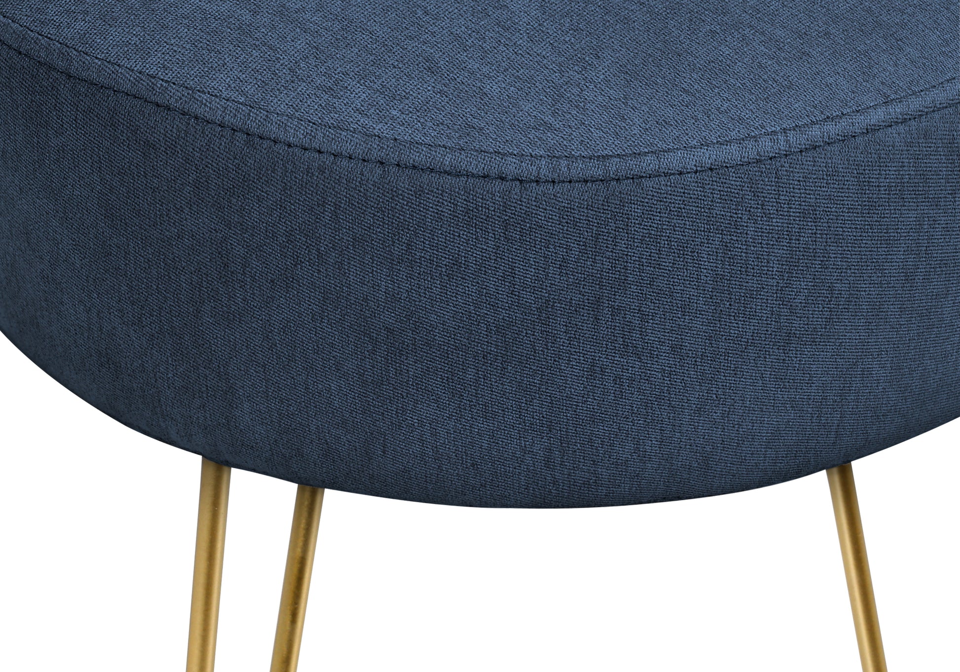 Dark blue upholstered stool with gold metal legs showcasing textured fabric detail