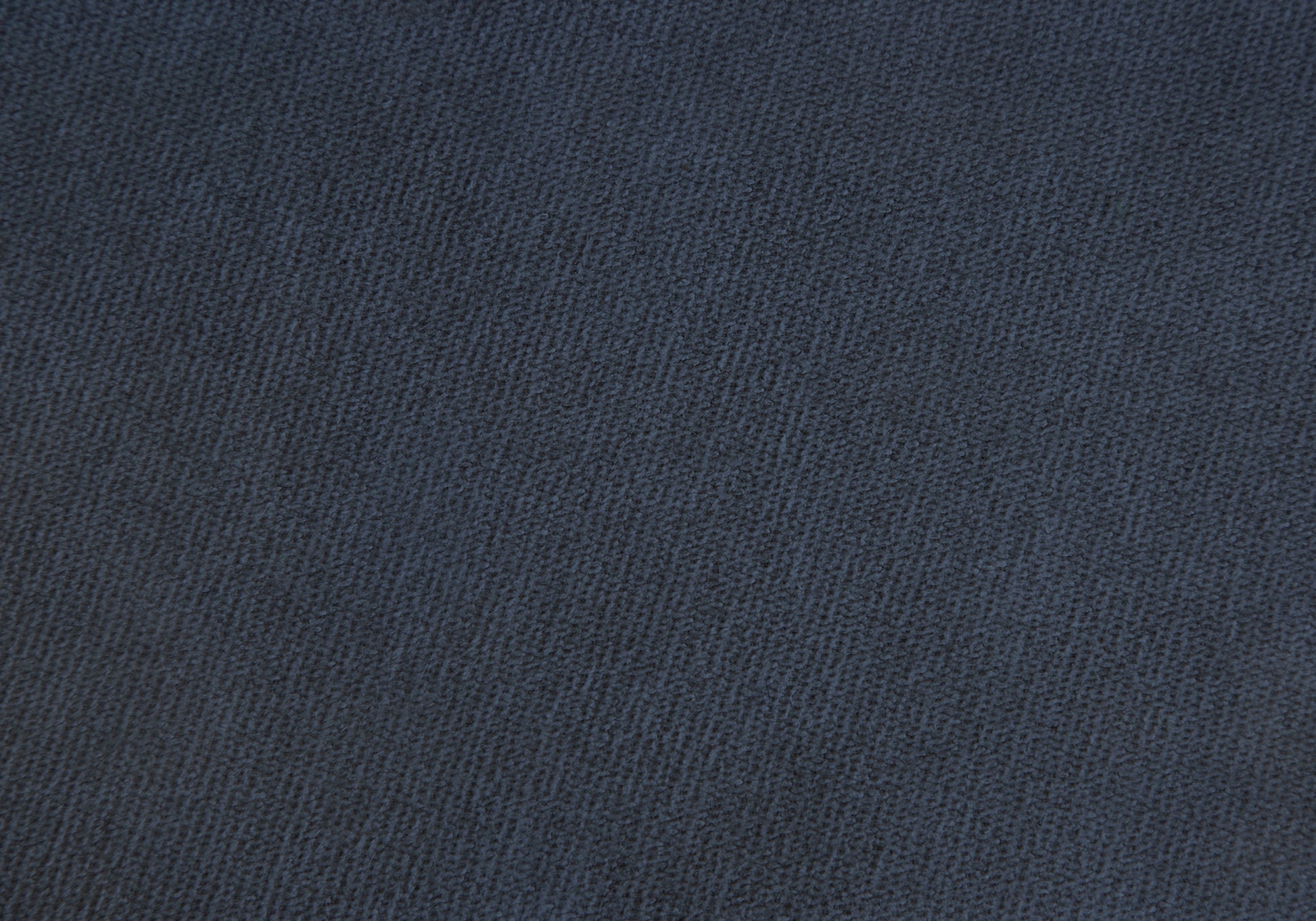 Closeup of textured dark navy fabric swatch ideal for upholstery or apparel