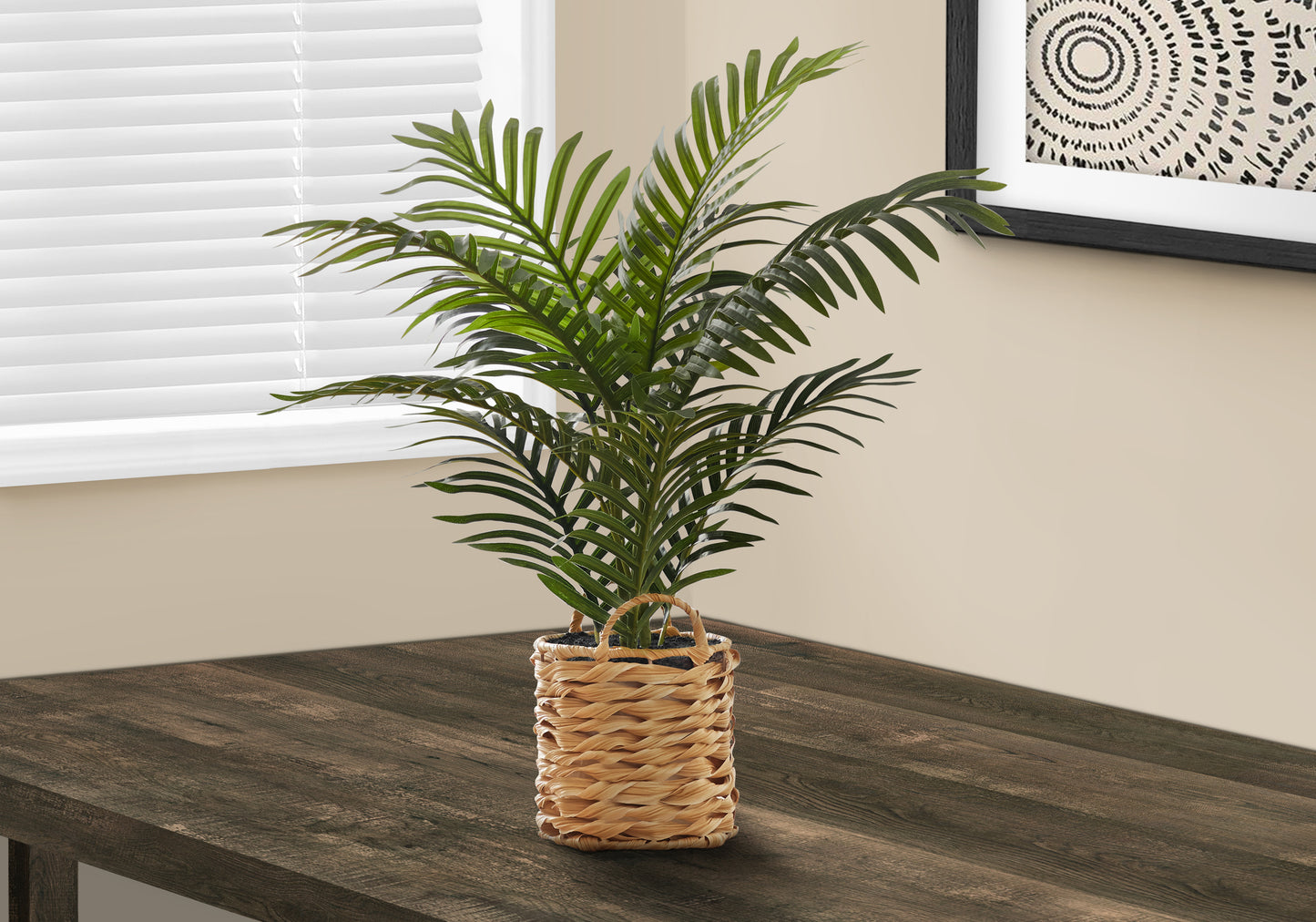 Faux parlor palm plant in woven basket planter adding greenery to home decor