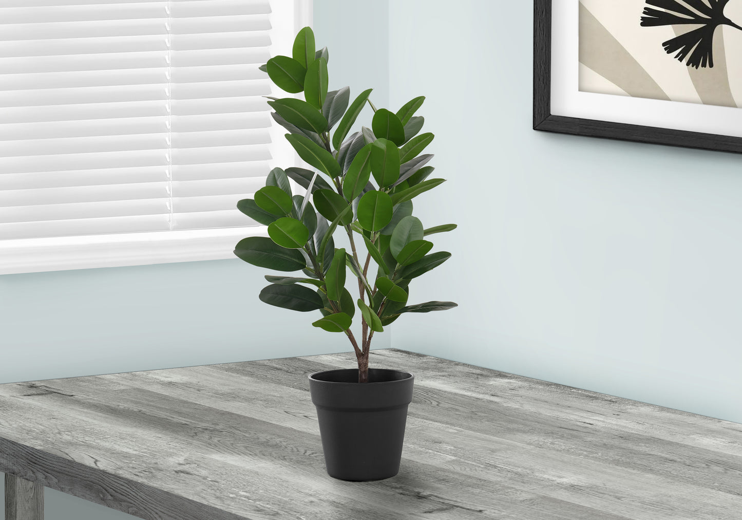 Vibrant green faux ficus plant in a black pot ideal for indoor decor