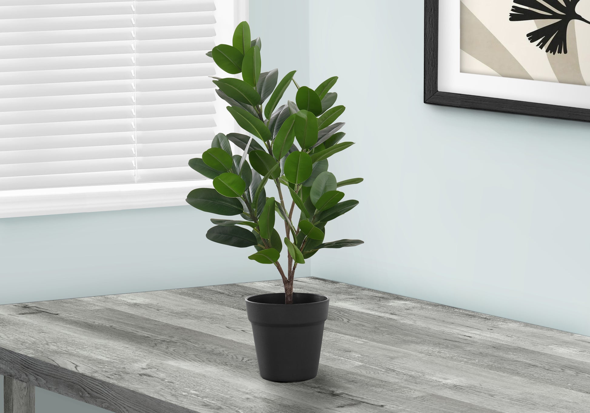 Vibrant green faux ficus plant in a black pot ideal for indoor decor
