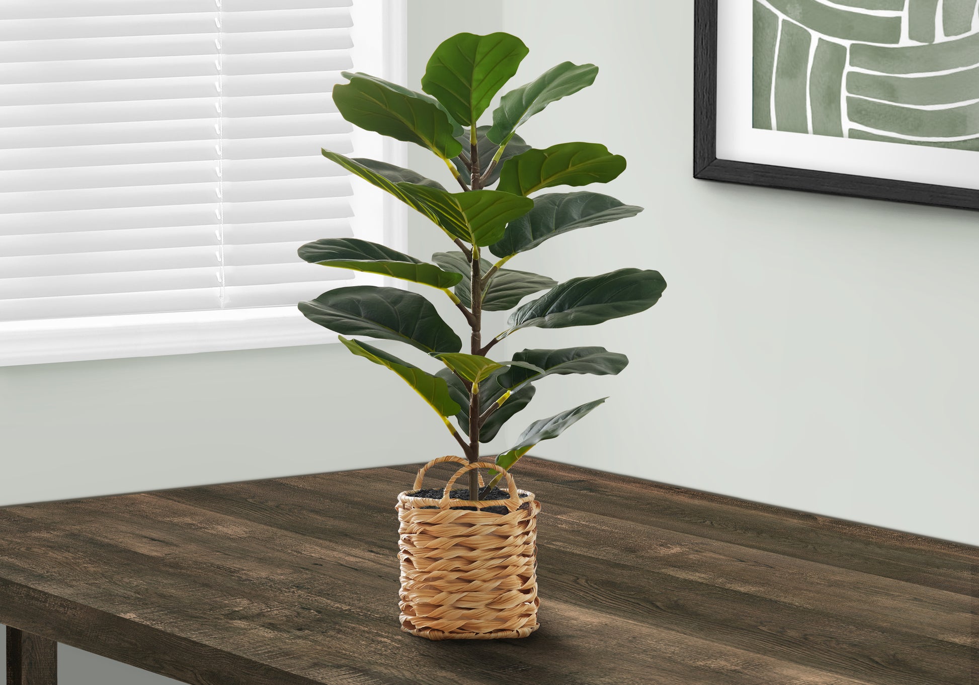Fiddle leaf fig artificial plant with dark green leaves in woven basket planter