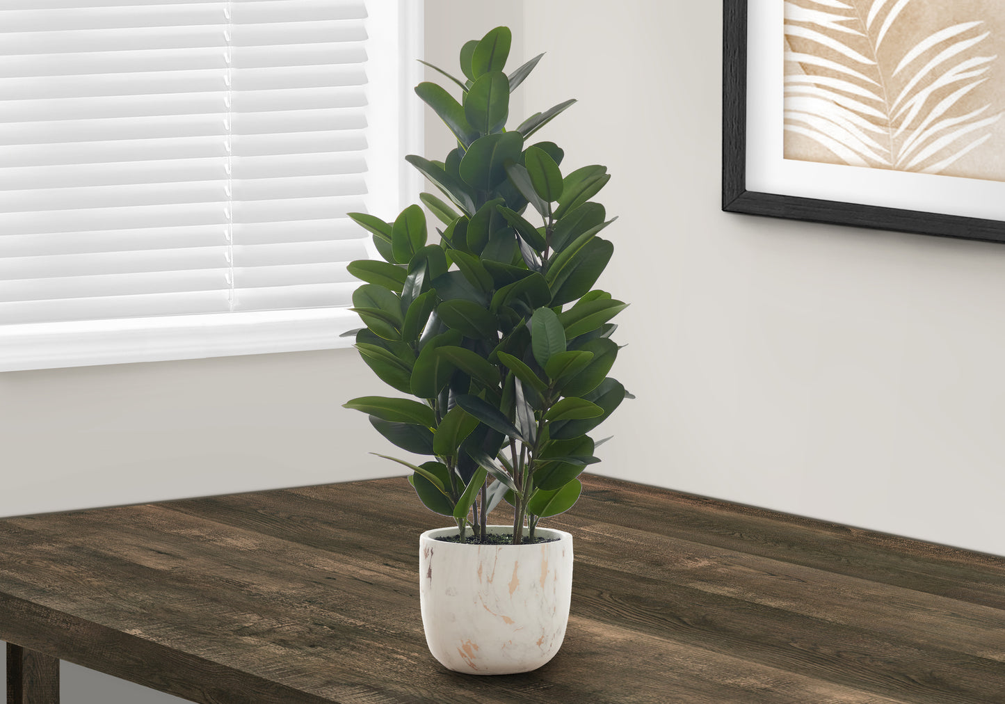 Tall artificial rubber plant with dark green leaves in a marbled pot ideal for home decor
