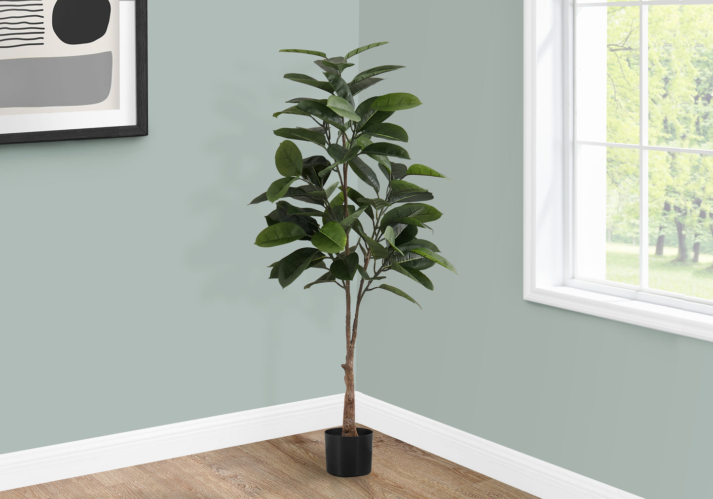 Tall realistic artificial ficus tree with dark green leaves in a black pot for indoor decor