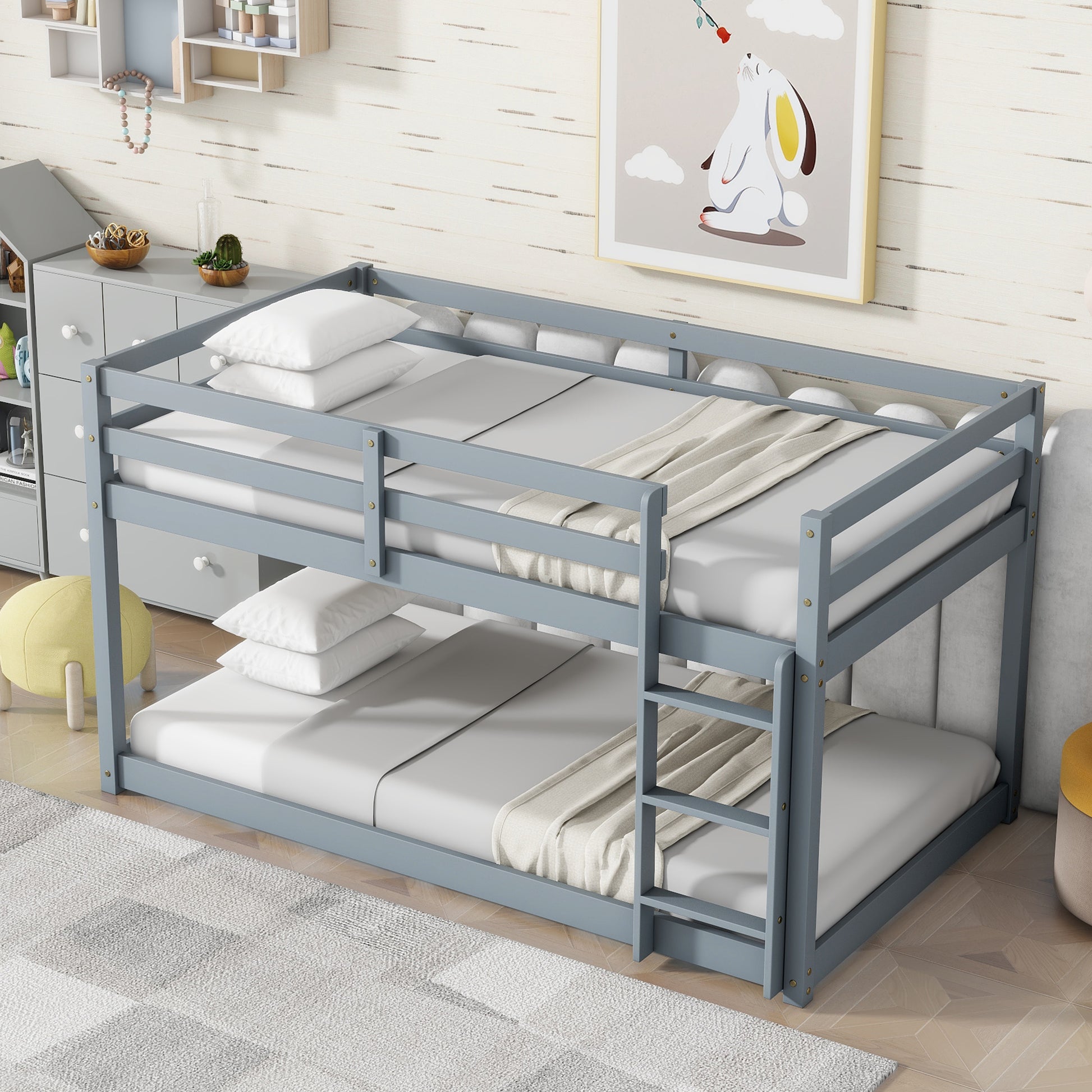 Gray wooden twin over twin bunk bed with ladder and white bedding