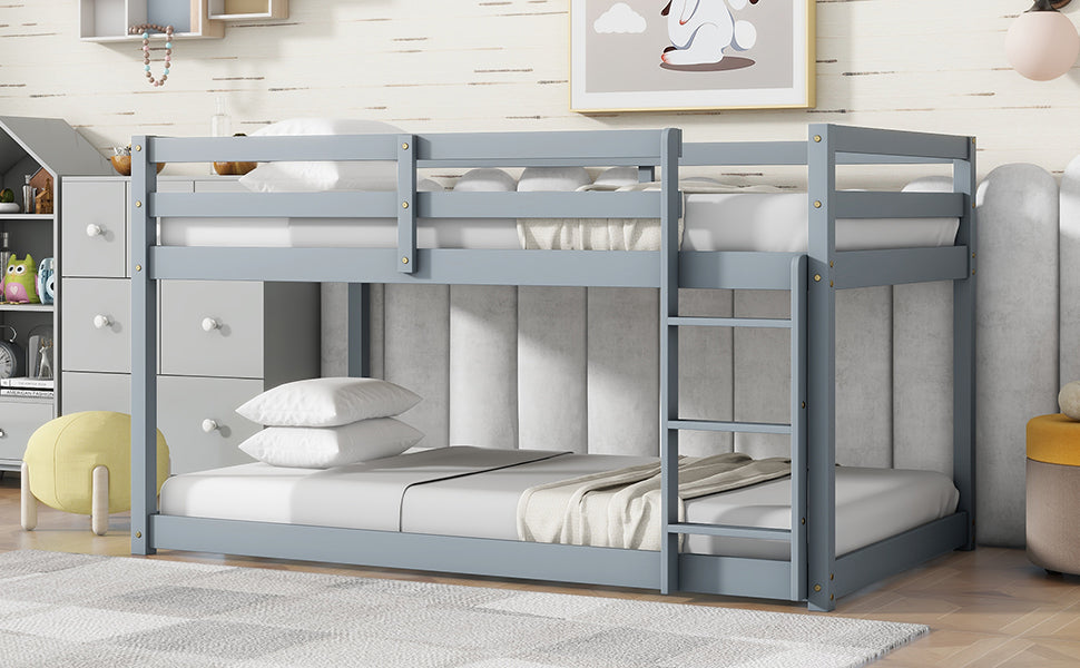 Gray wooden bunk bed with two mattresses and white bedding
