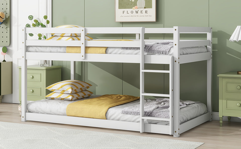 White wooden twin over twin bunk bed with yellow and grey bedding